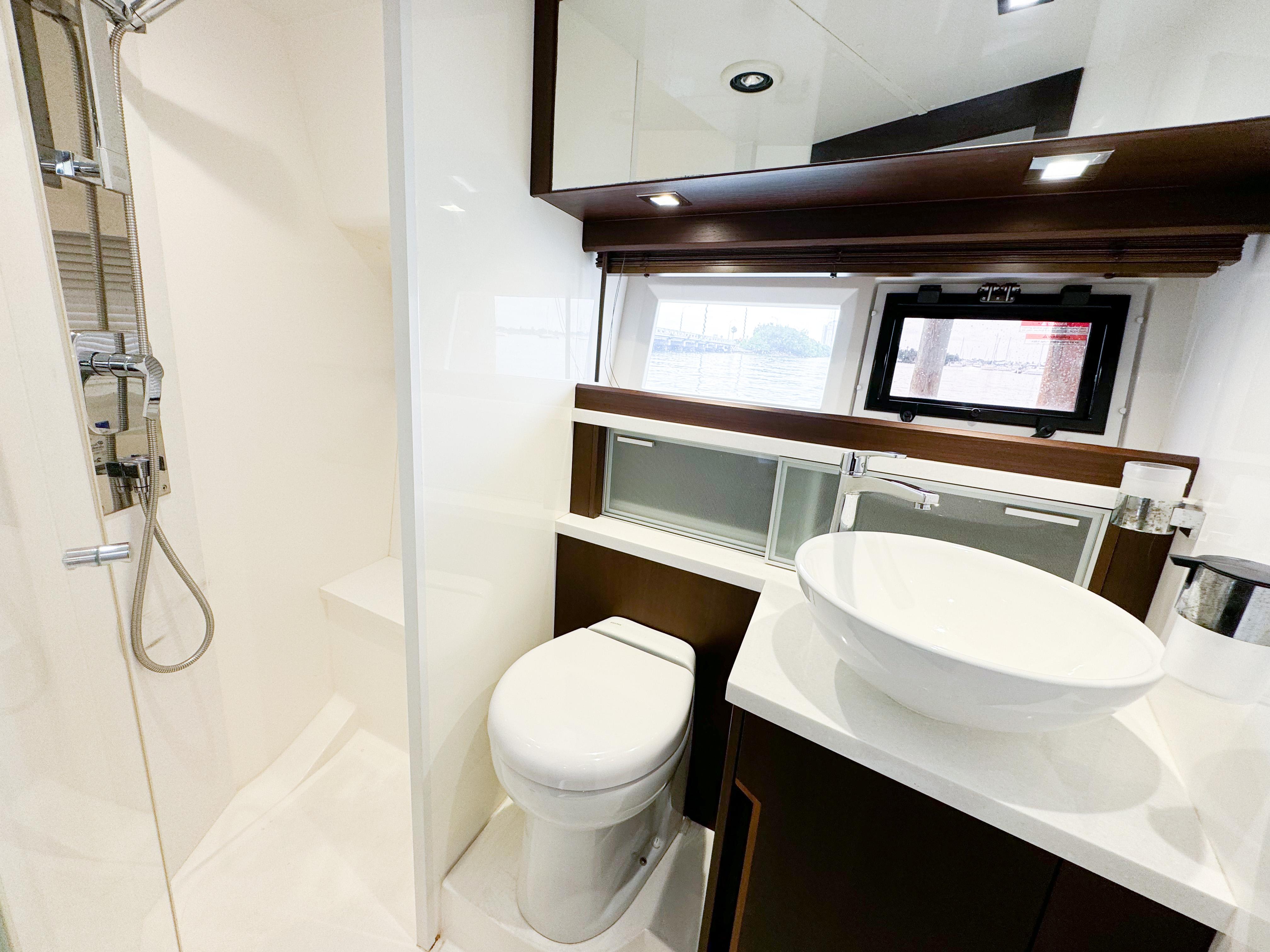 Luxurious bathroom in 2016 Galeon 420 Fly yacht with modern fixtures and elegant design.