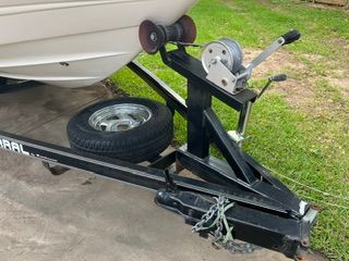 A 2004 Chaparral 190 SSi boat on a trailer with a spare tire and winch.