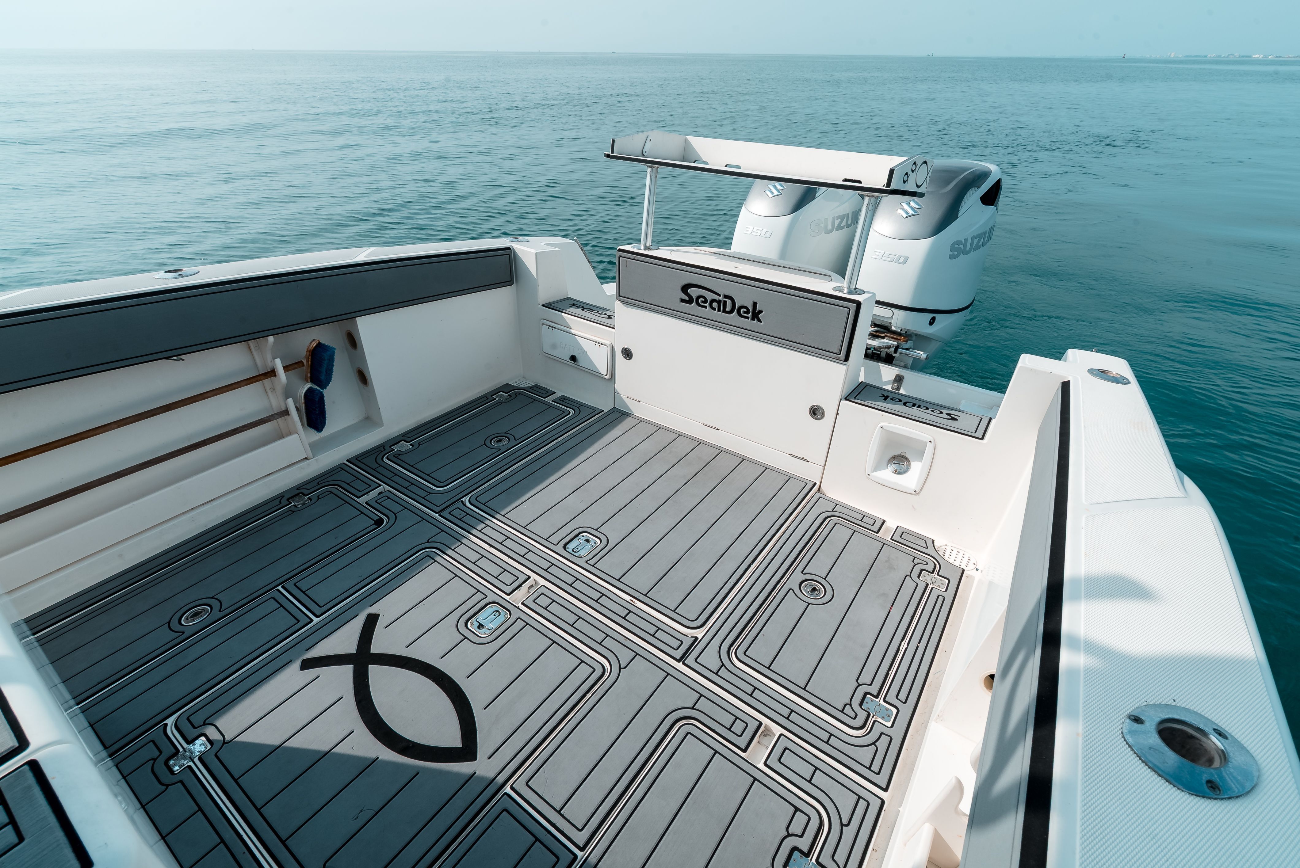 The image shows the deck of a 2006 Tempest Offshore 40 boat on calm water.