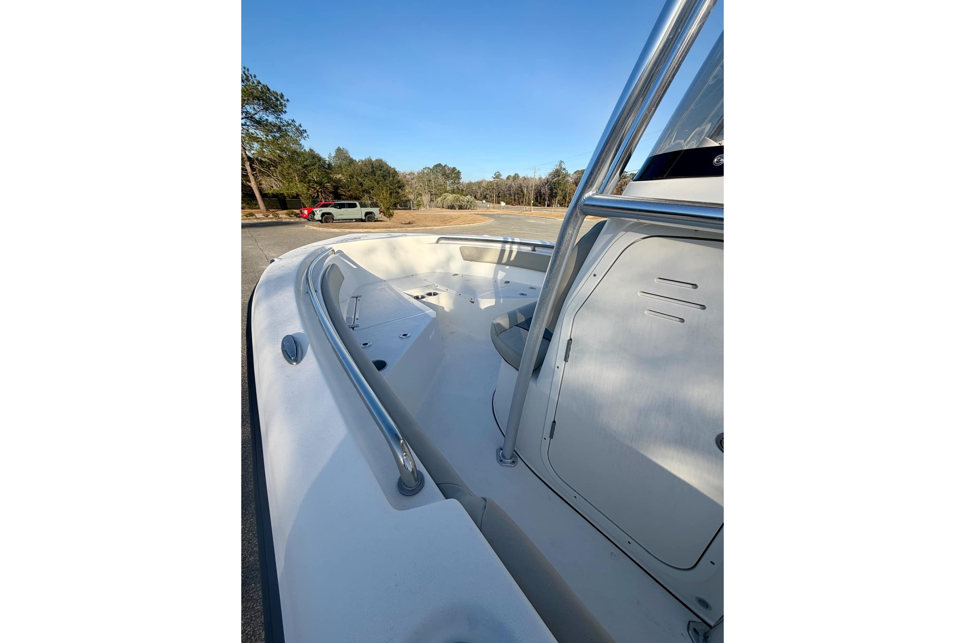 2026 Key West 203 FS boat interior with sleek design and stainless steel railings.
