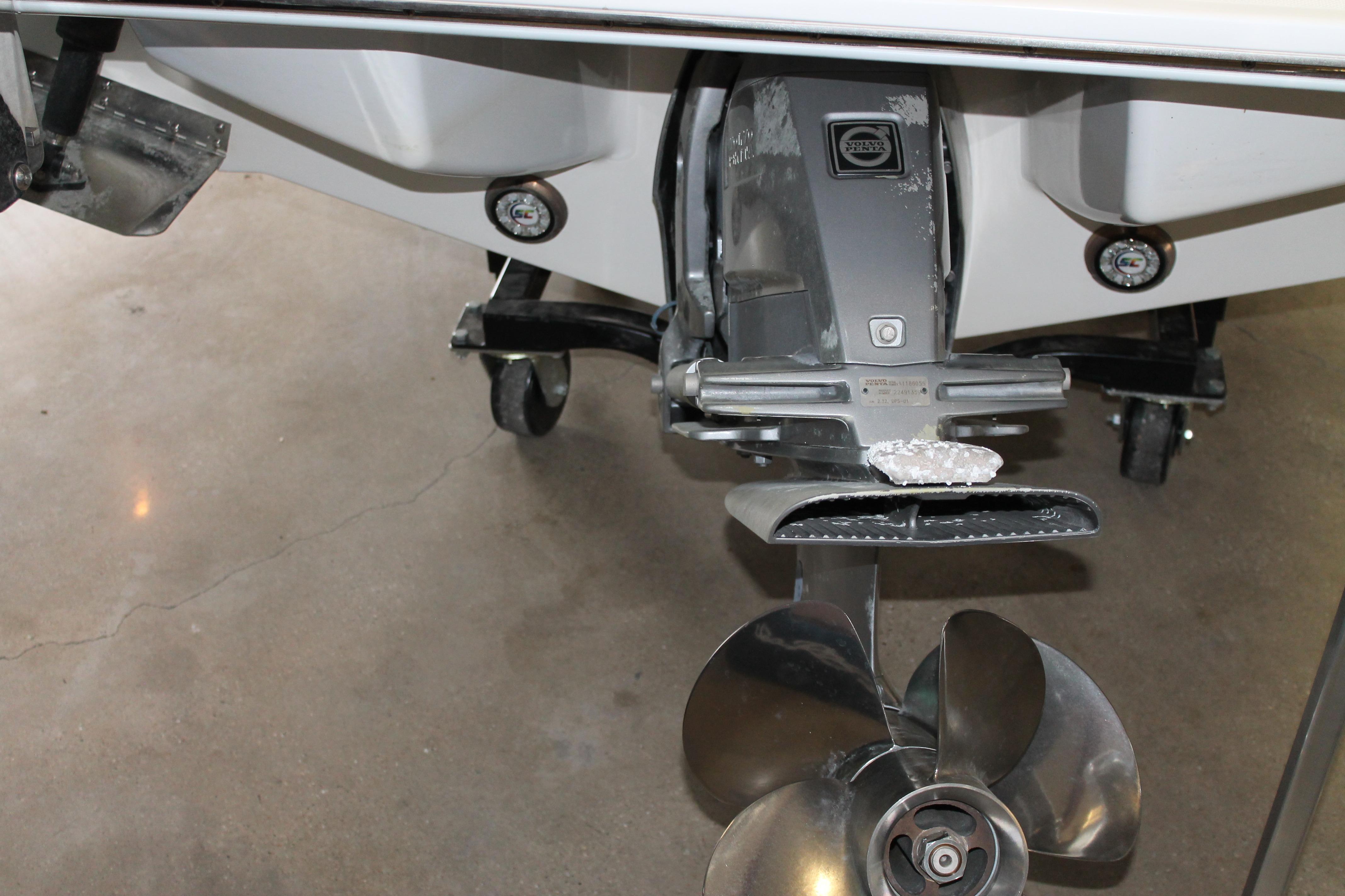 2023 Cobalt R8 boat propeller and stern drive on display in a showroom.
