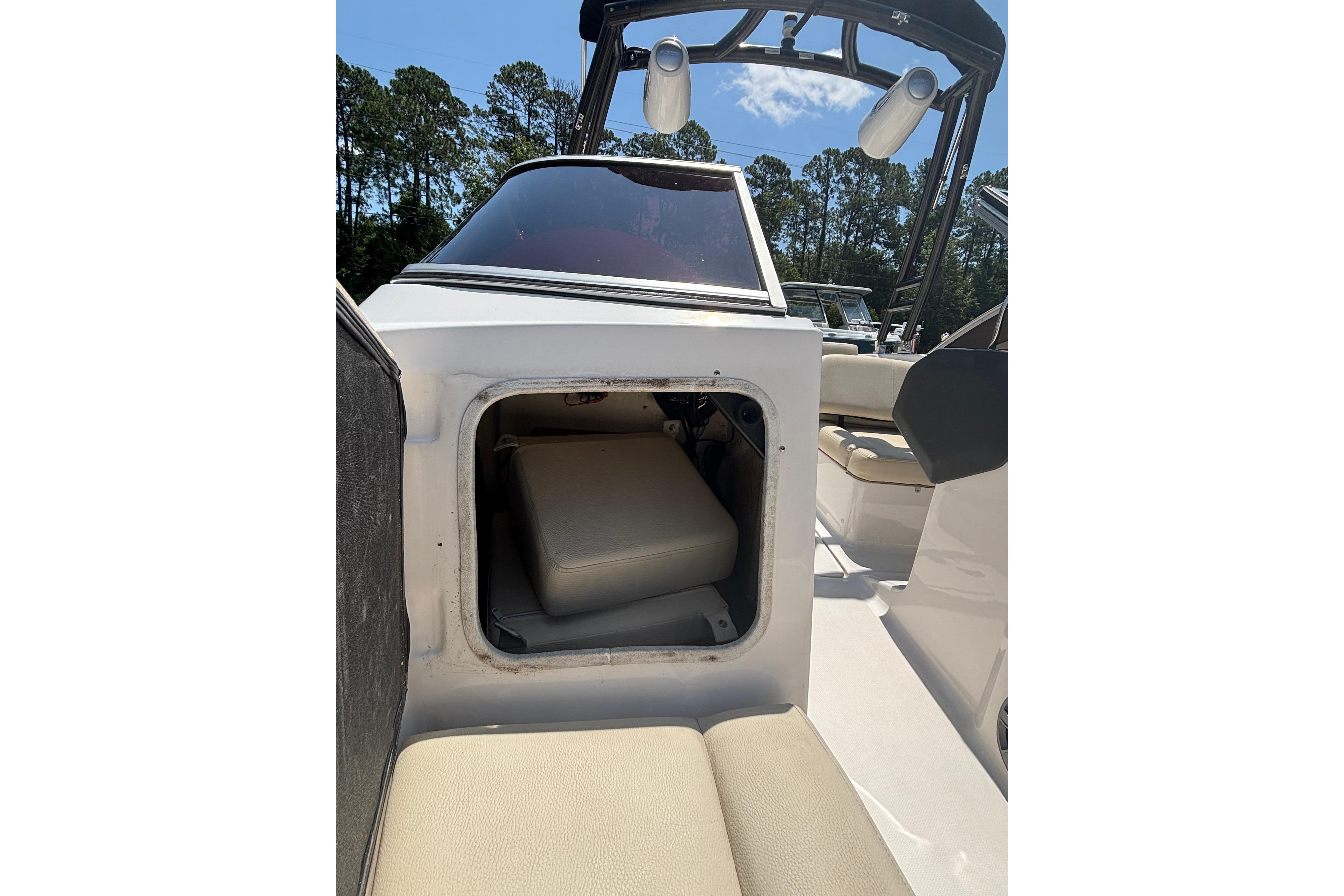 2018 Regal 1900 ES Bowrider interior storage compartment with seating and canopy.