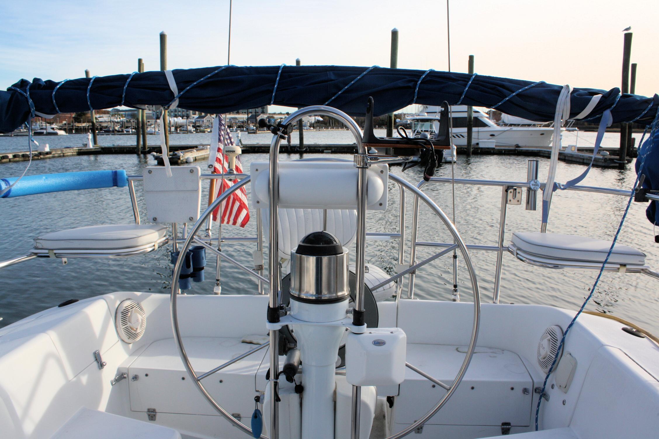 Cockpit view of a 1996 Catalina 34 MkII sailboat docked at a marina.