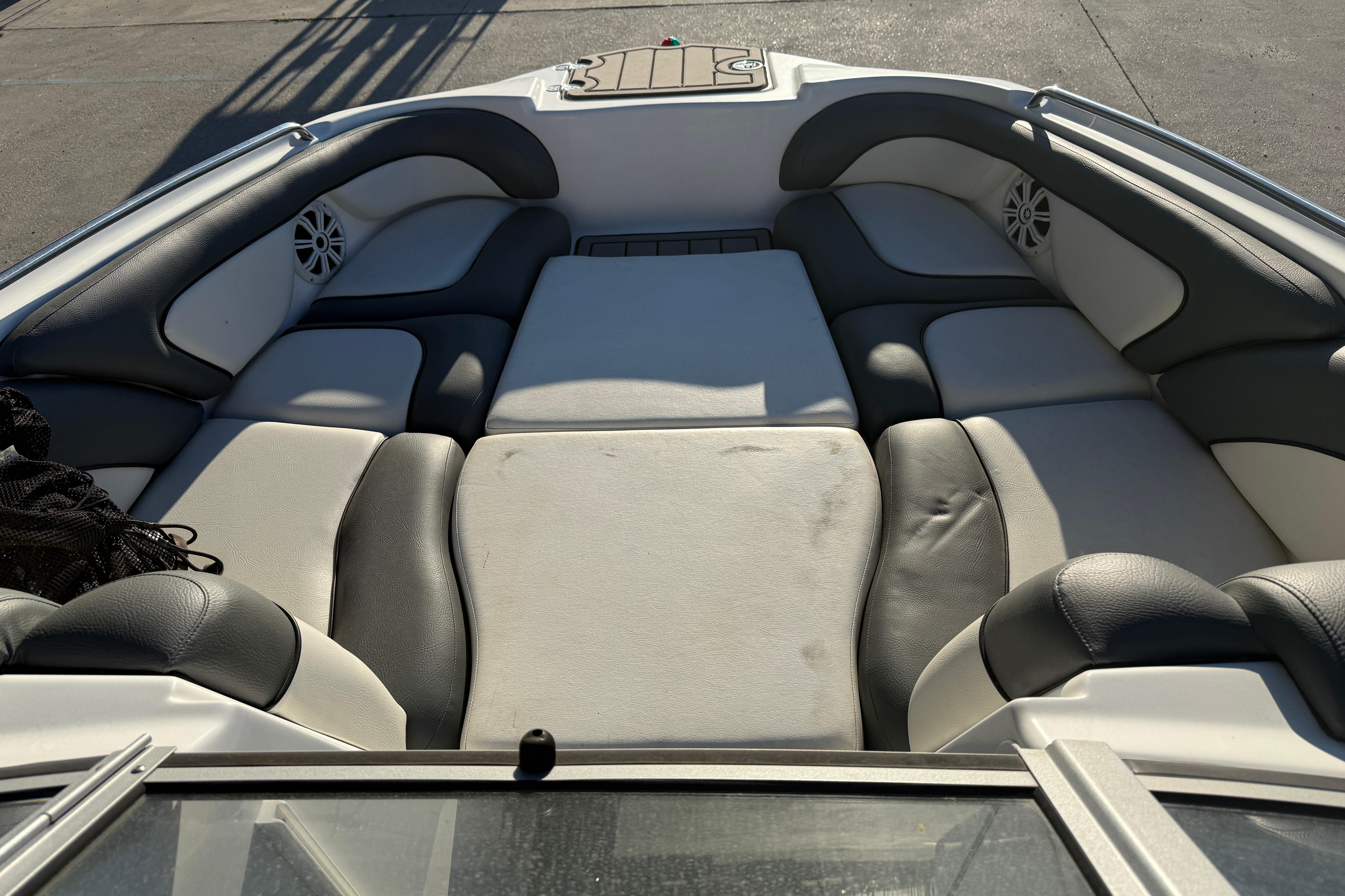 Interior seating of a 2011 Yamaha Boats 242 Limited S, featuring cushioned seats.