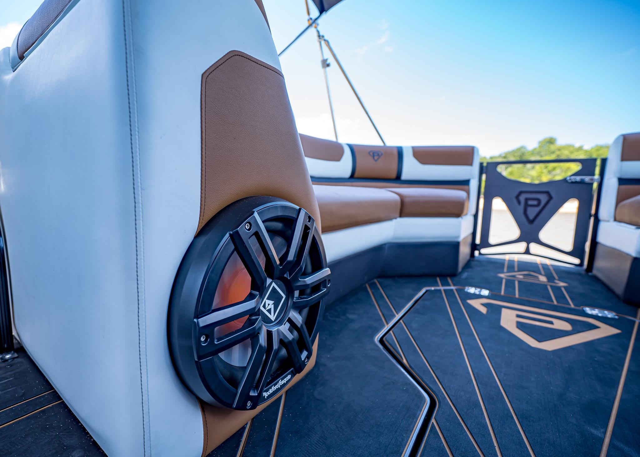 Luxury Paradigm 236 boat interior with premium seating and audio system, 2025 model.