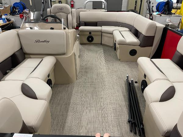 2025 Bentley Pontoons 200 Fish-N-Cruise interior with beige seating and spacious layout.