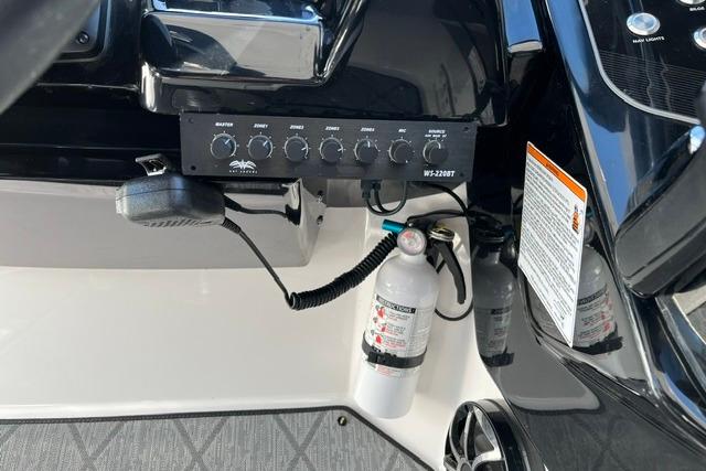 Control panel and fire extinguisher on 2021 Yamaha Boats 275SD.