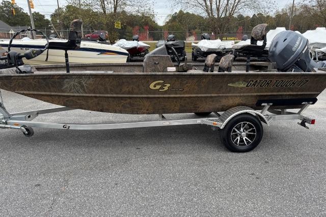 2023 G3 Gator Tough 17 SC boat on trailer, parked outdoors.