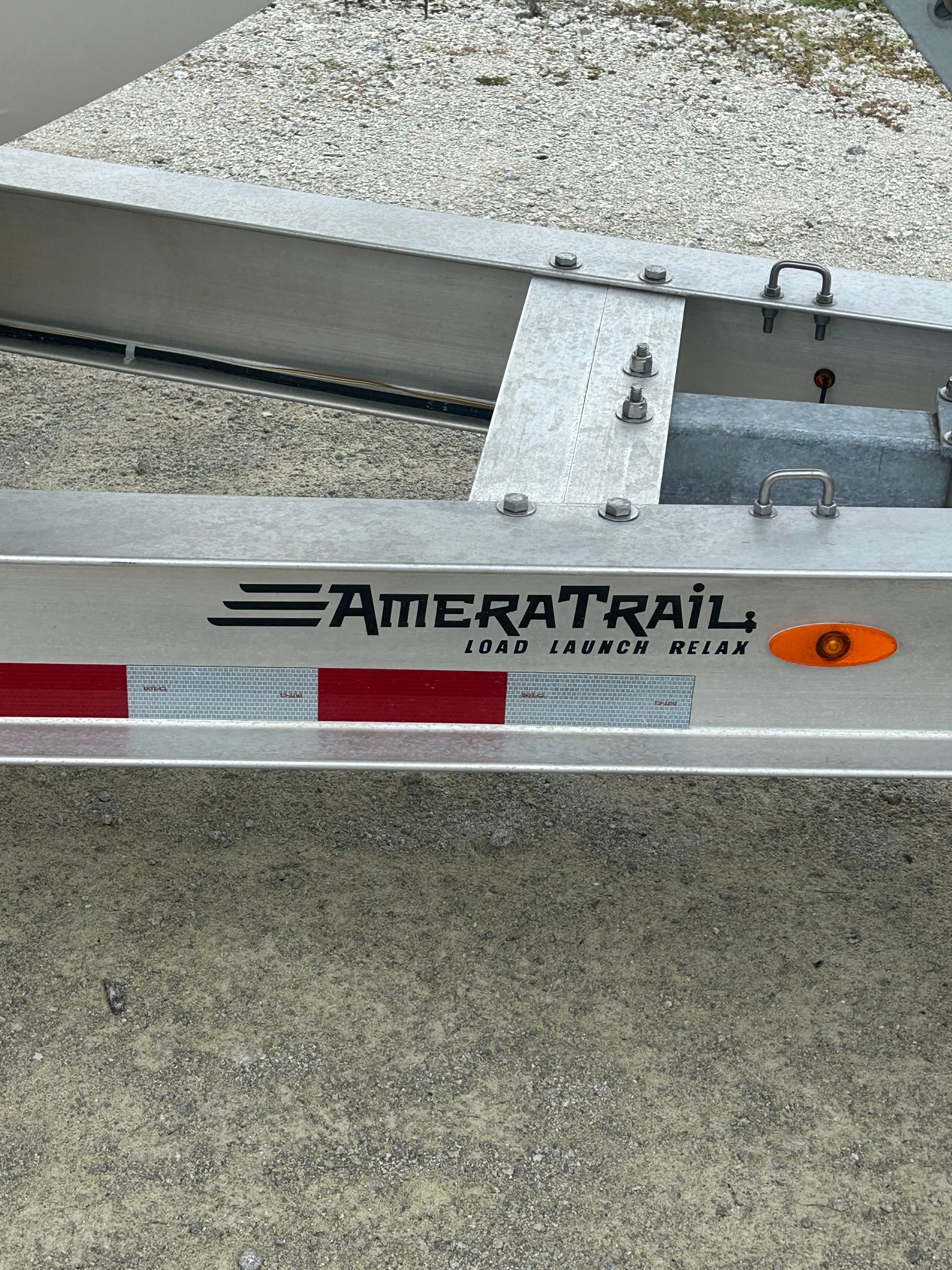 Trailer with AmeraTrail logo and reflective stripes.
