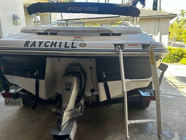 The image shows the rear of a 2006 Four Winns 190 Horizon boat with a ladder.