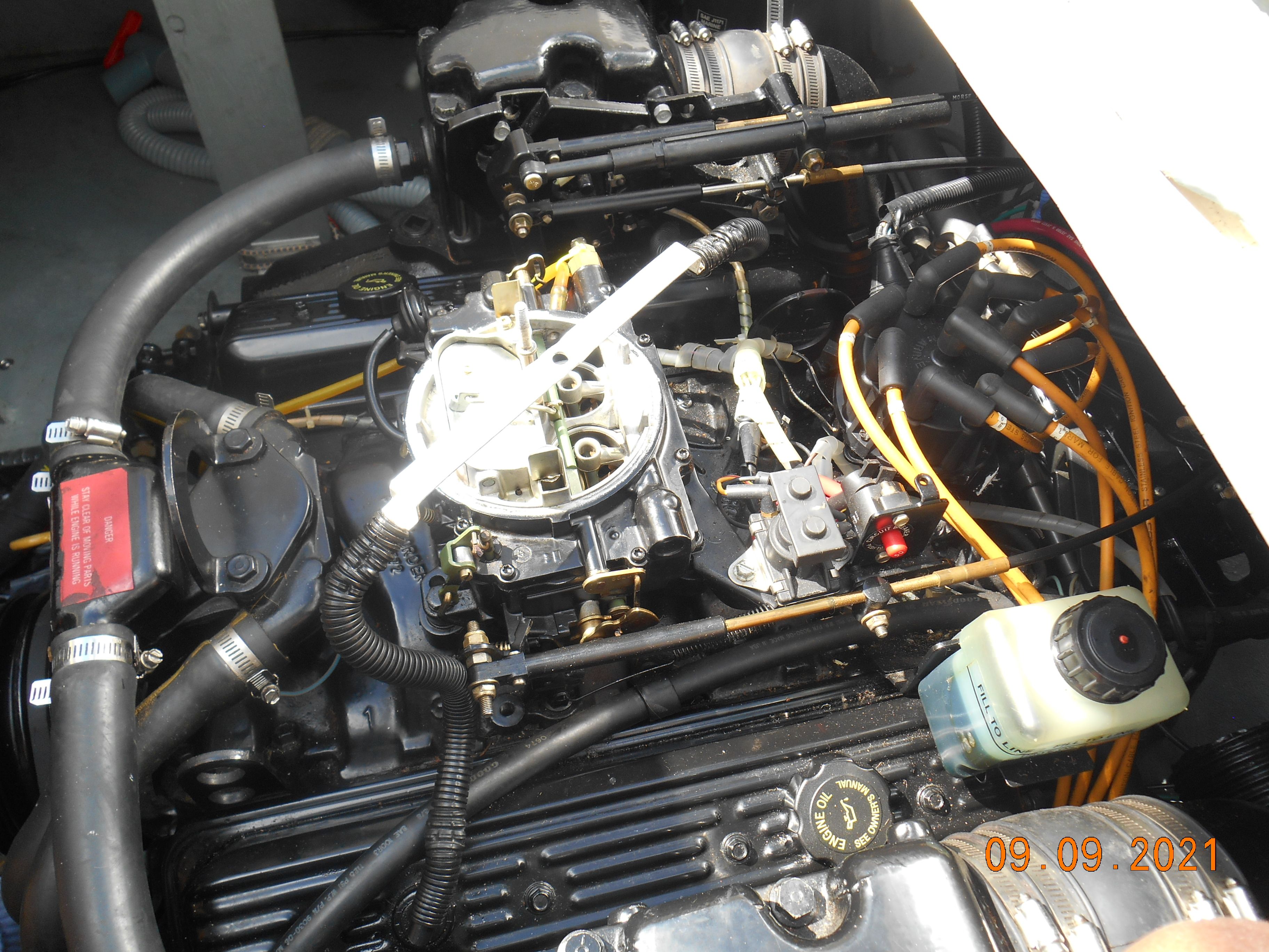Engine compartment of a 1994 Sea Ray 230 Sundancer boat, close-up.