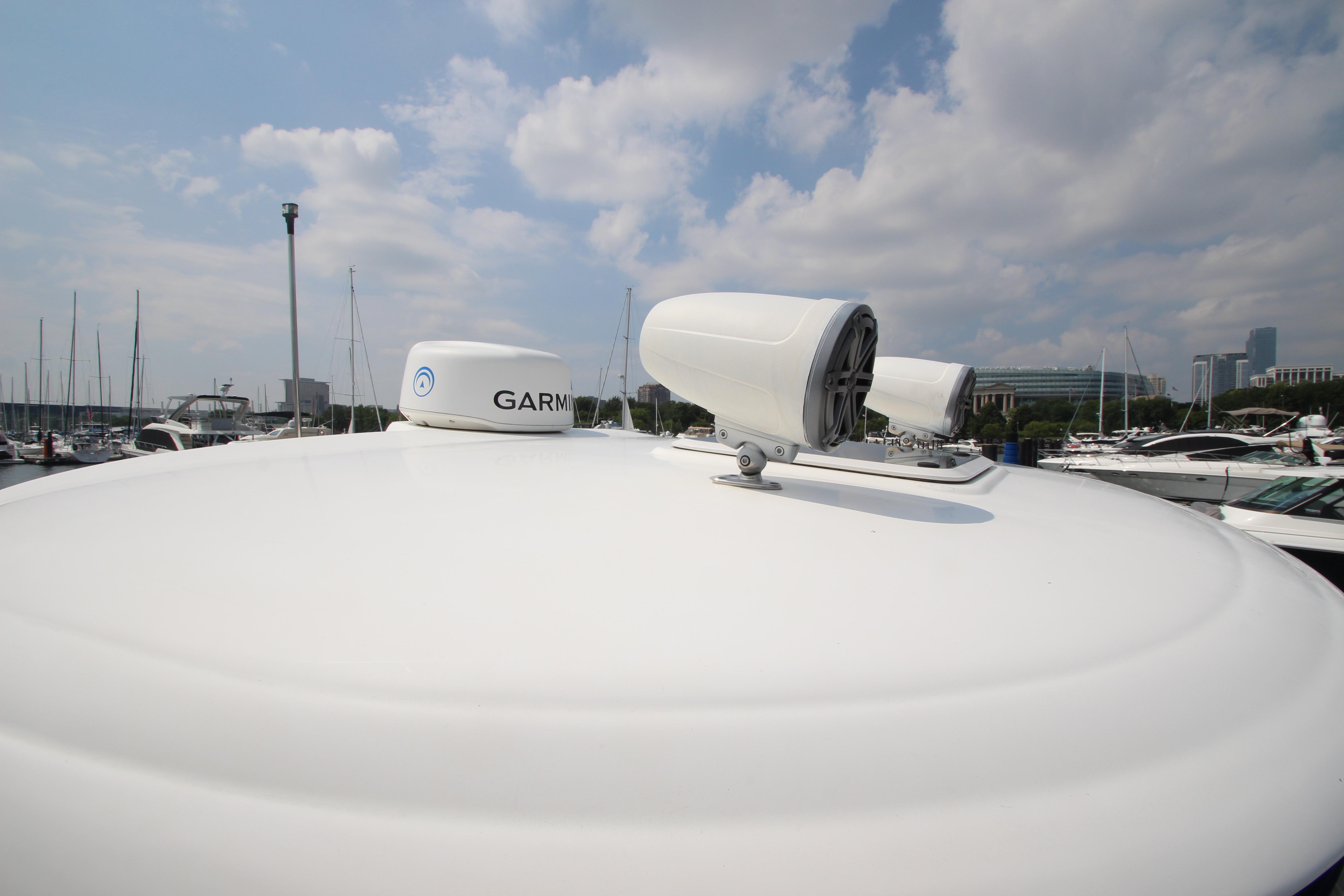 Radar equipment on a 2004 Sea Ray 40 Sundancer yacht under a cloudy sky.