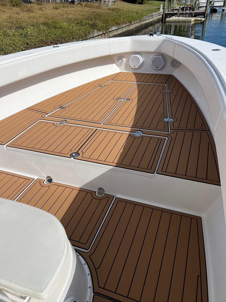 2006 Venture 39 Open boat with wooden deck and white interior.
