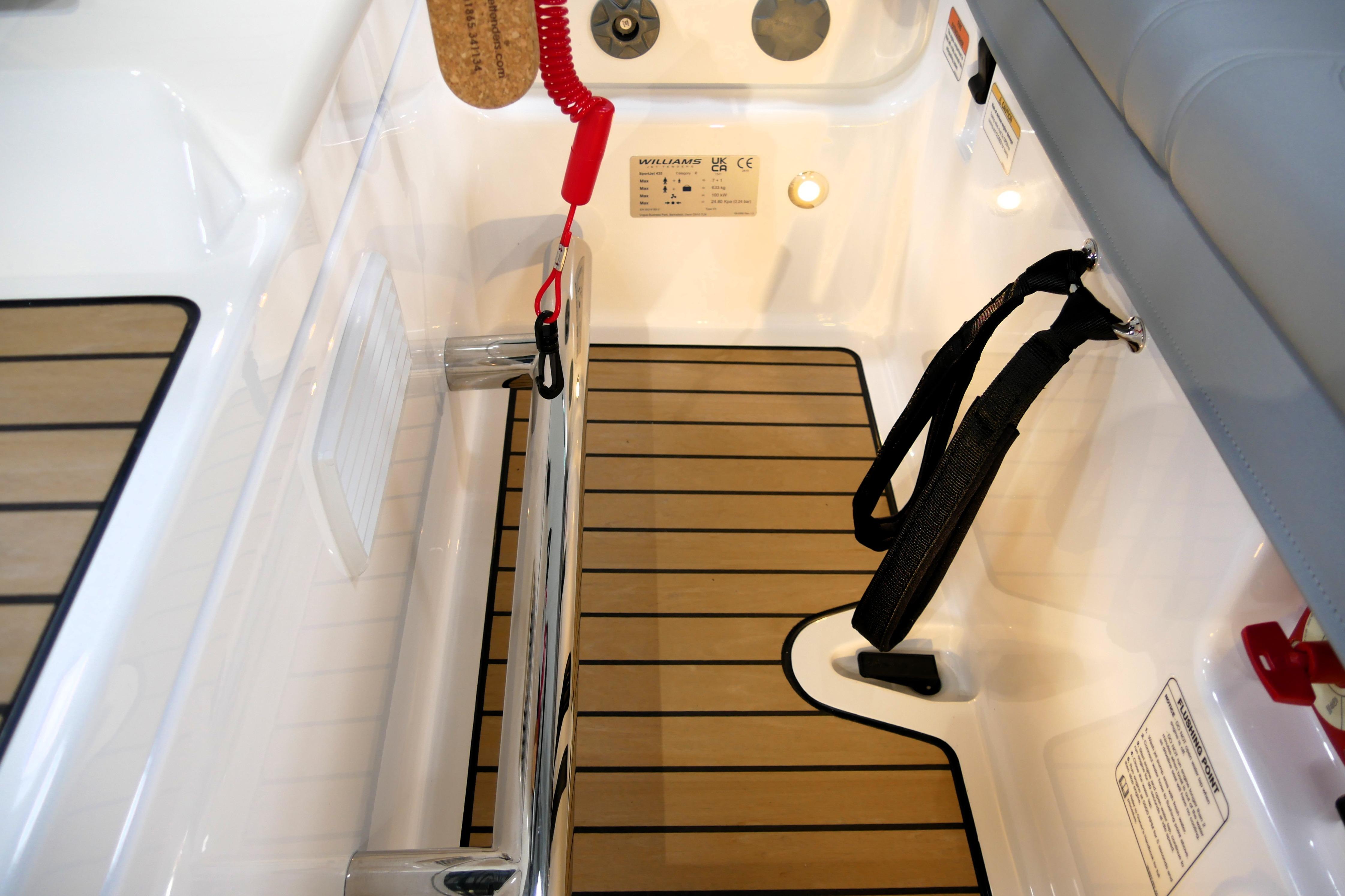 Interior view of 2026 Williams Jet Tenders Sportjet 435, featuring sleek design and wood accents.