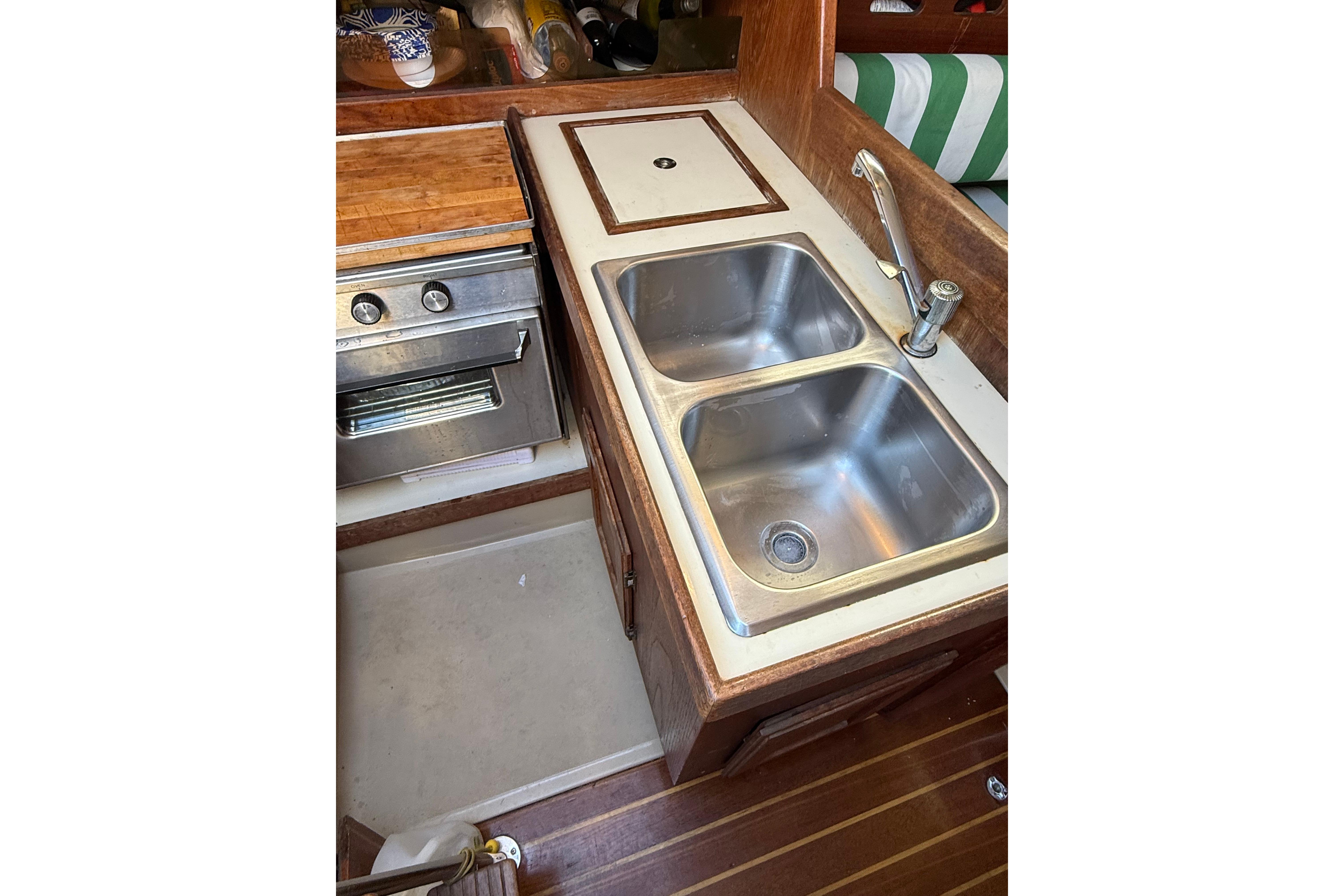 1983 O'Day 34 yacht kitchen with double sink and stove.