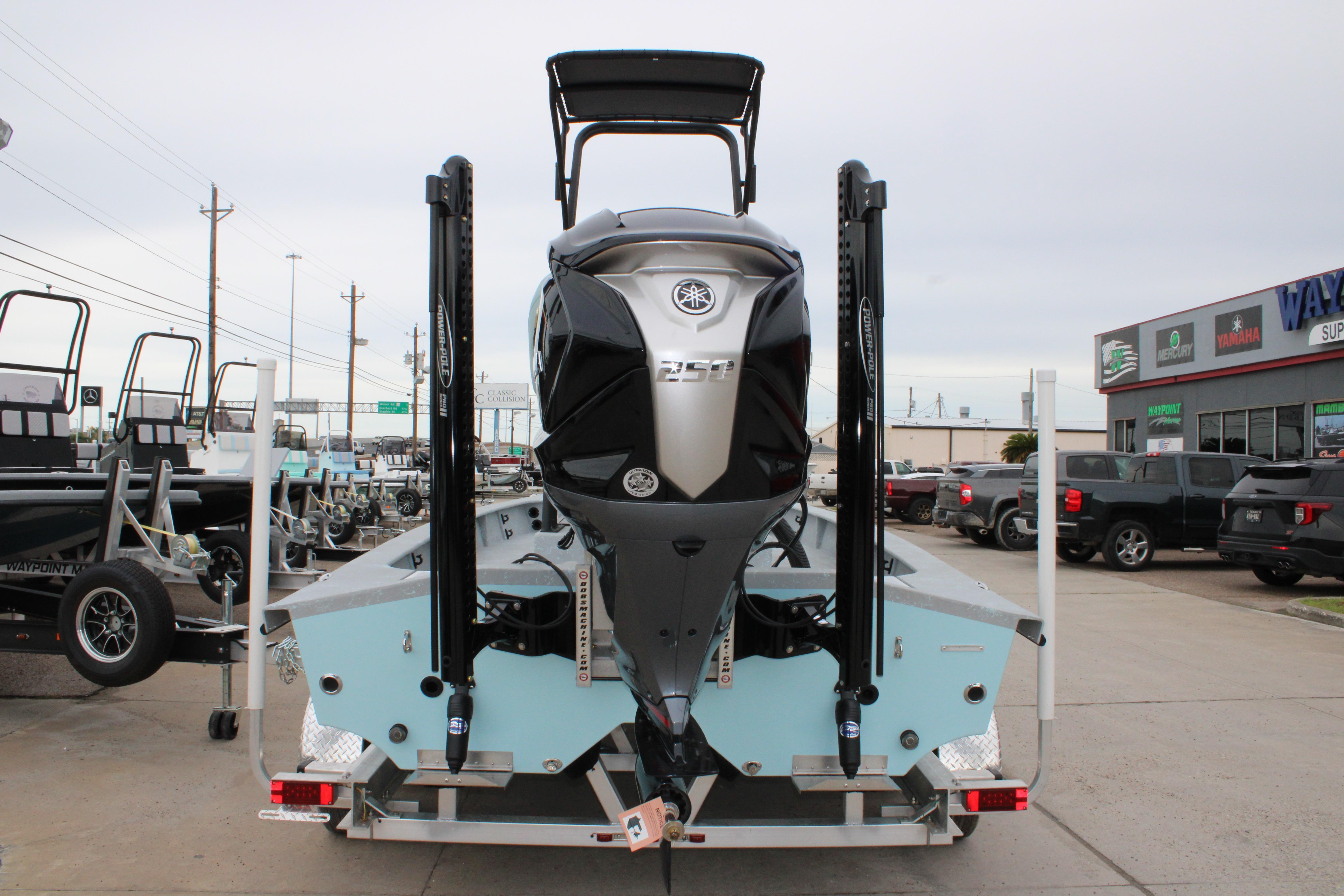 2026 Freedom Boats 24 Defender with Yamaha outboard motor, displayed at dealership.