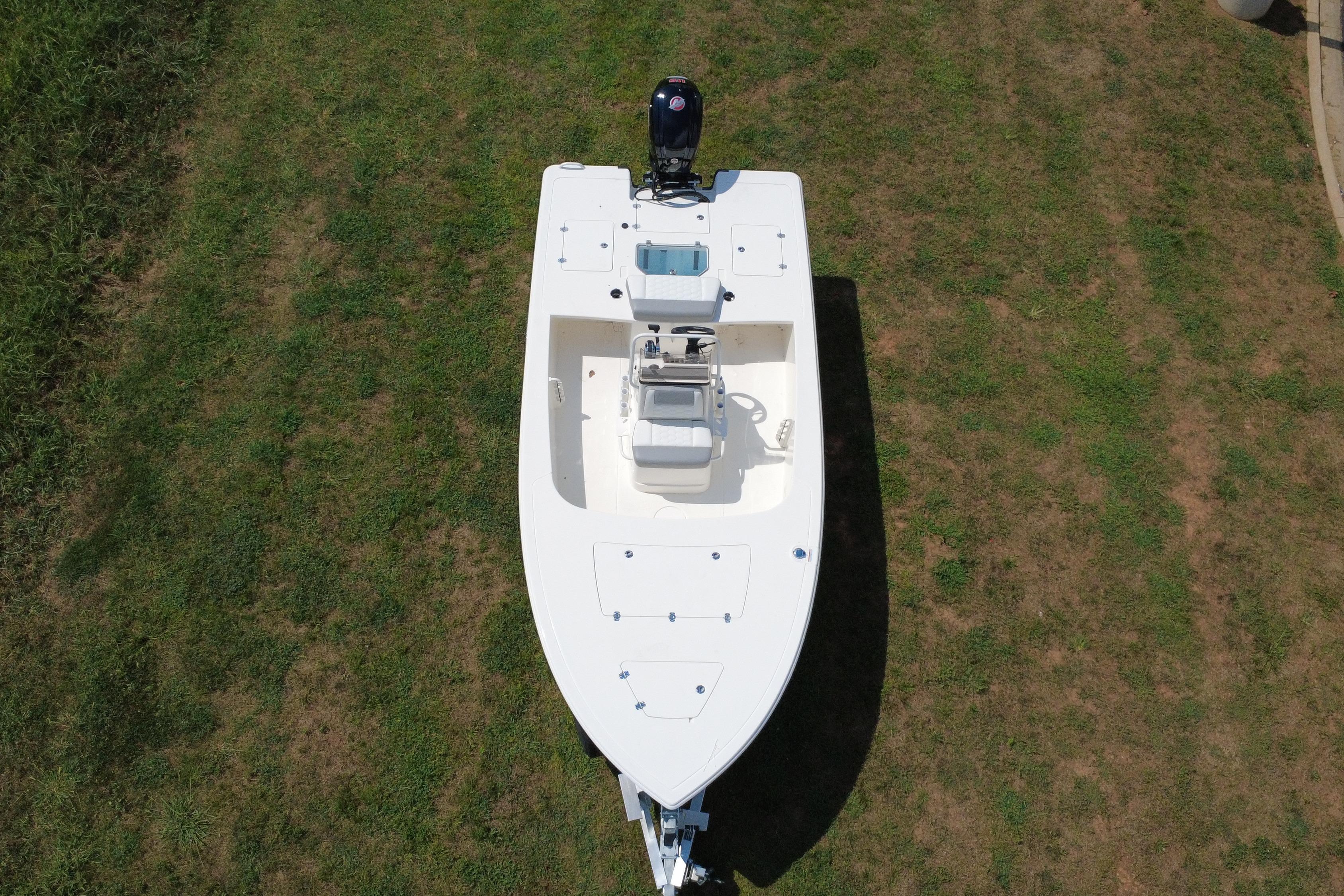 2026 Mako 18 Pro Skiff boat on grass, aerial view.