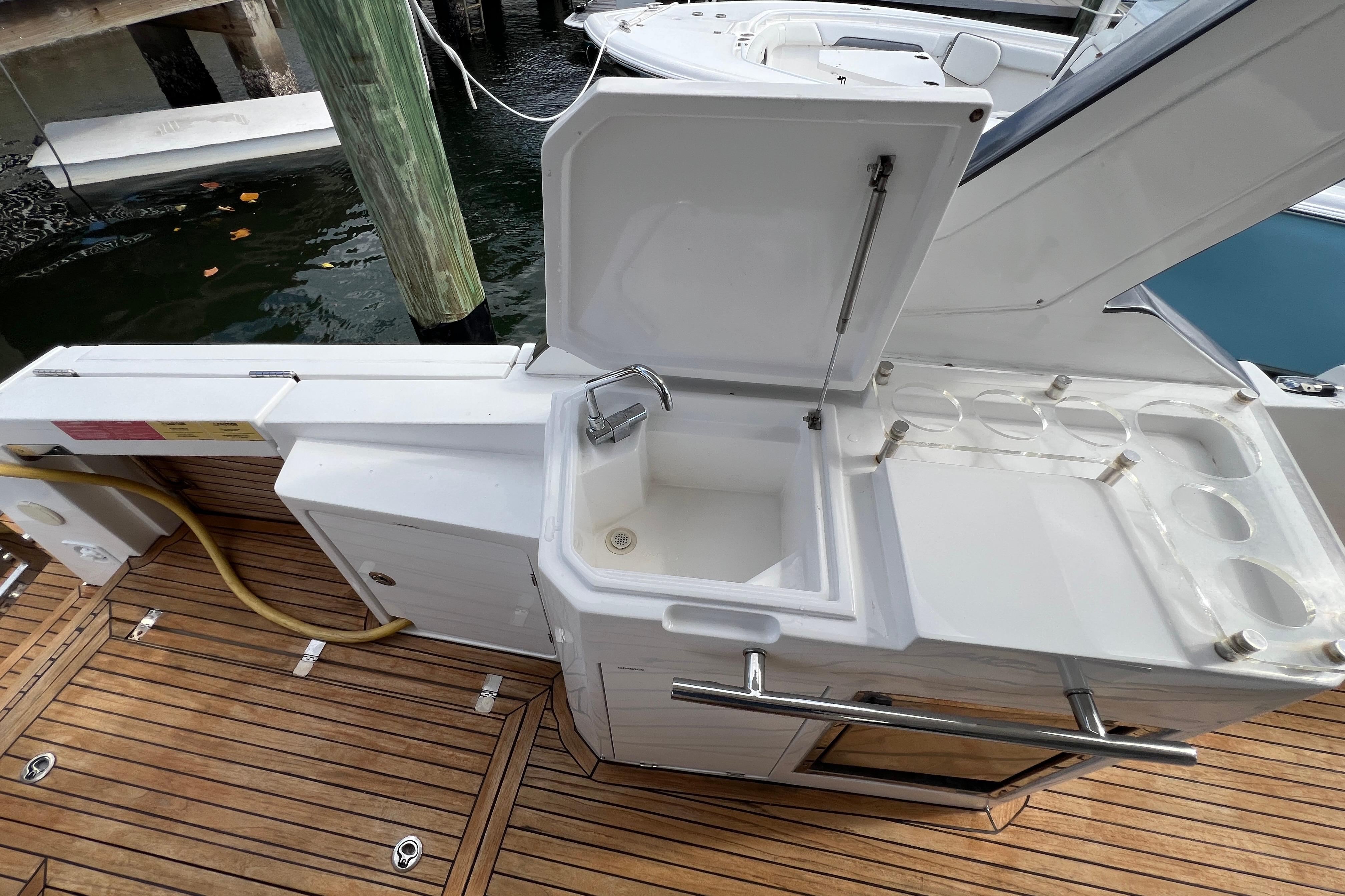 Outdoor sink and storage area on 2018 Azimut Verve 40 yacht deck.