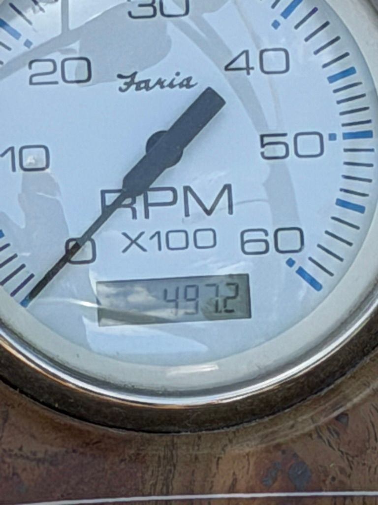 Close-up of a tachometer showing 4972 RPM.