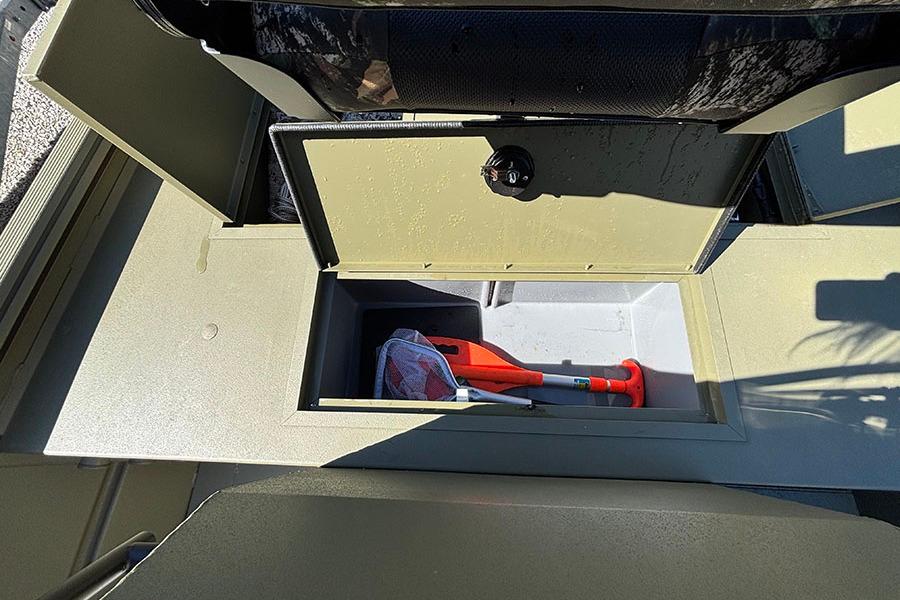 2022 Lowe Roughneck 1660 boat storage compartment with safety equipment inside.