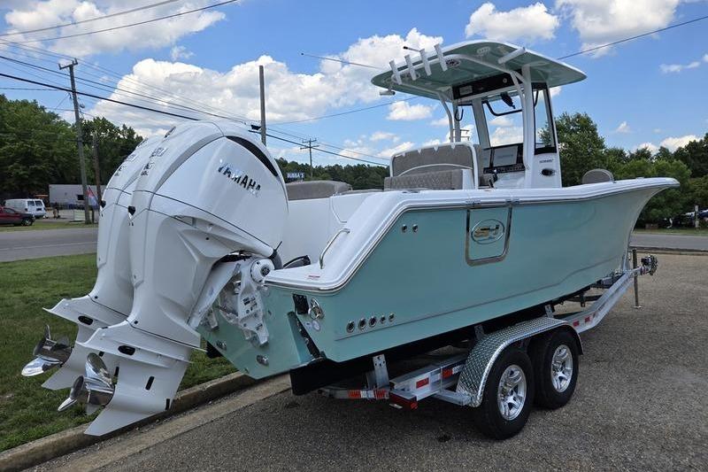 2027 Sea Hunt Ultra 275 SE boat on trailer, featuring dual Yamaha engines.