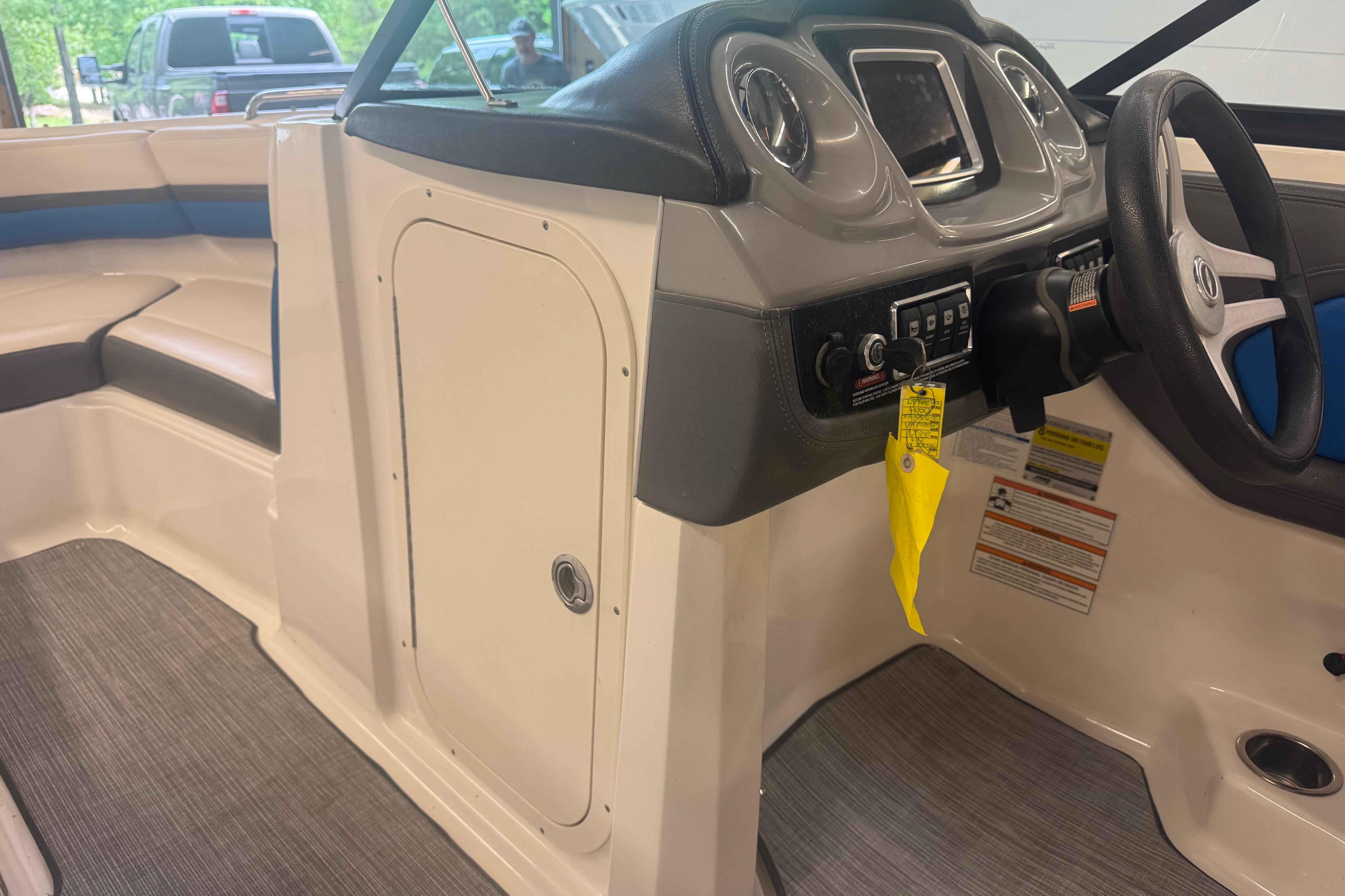 2017 Chaparral Vortex 203 VRX boat interior with steering console and seating.