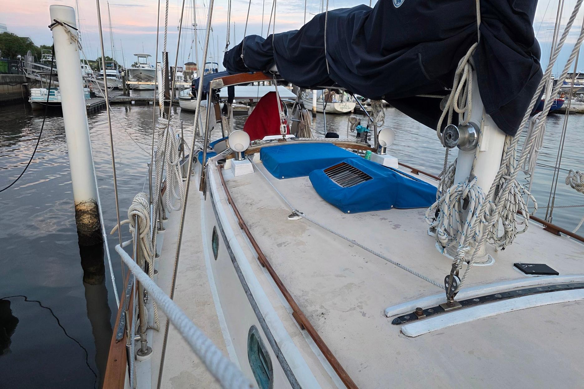 1982 Tayana 37 sailboat docked at marina, showcasing deck and rigging details.