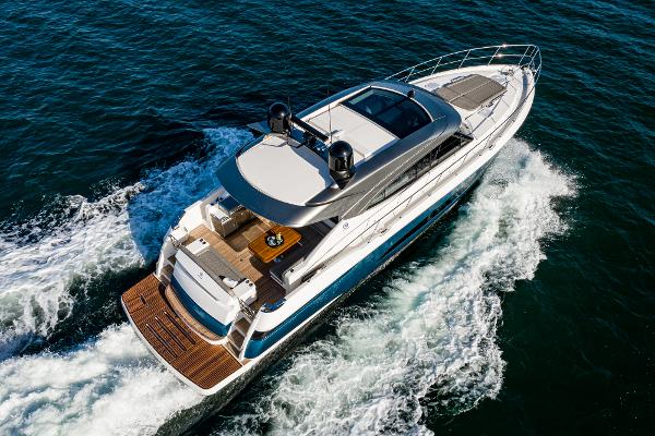 2021 Riviera 5400 Sport Yacht cruising on open water.