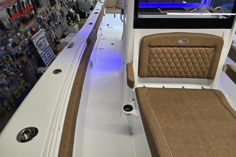 2026 Sea Hunt Ultra 275 Coffin Box interior with tan seating and modern design.
