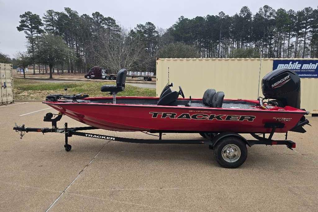 2026 Tracker Pro Team 175 Crappie Edition boat on trailer, parked outdoors.