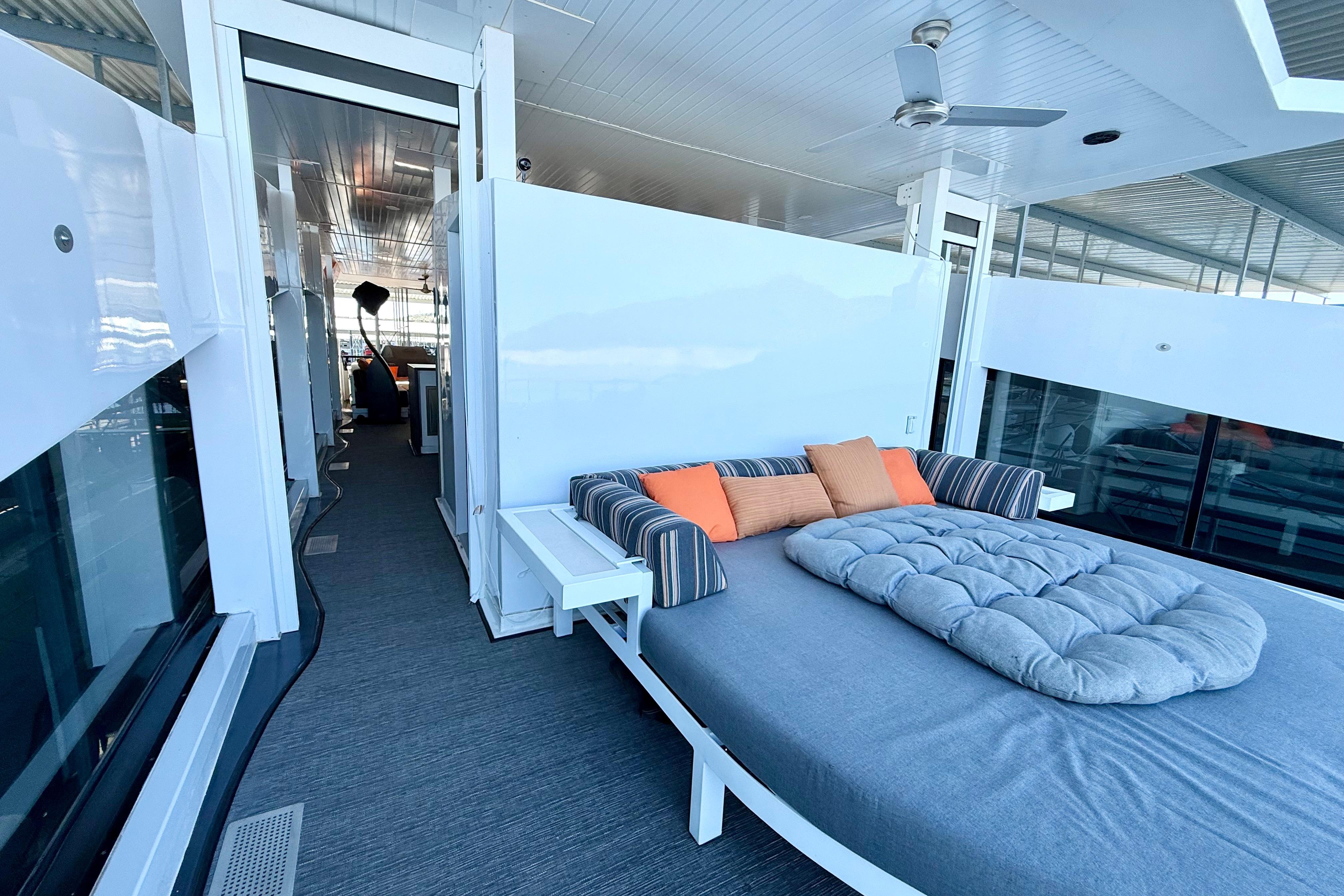 Luxurious deck of 2021 BRAVADA YACHTS Atlas V Series 8018 with cozy seating.