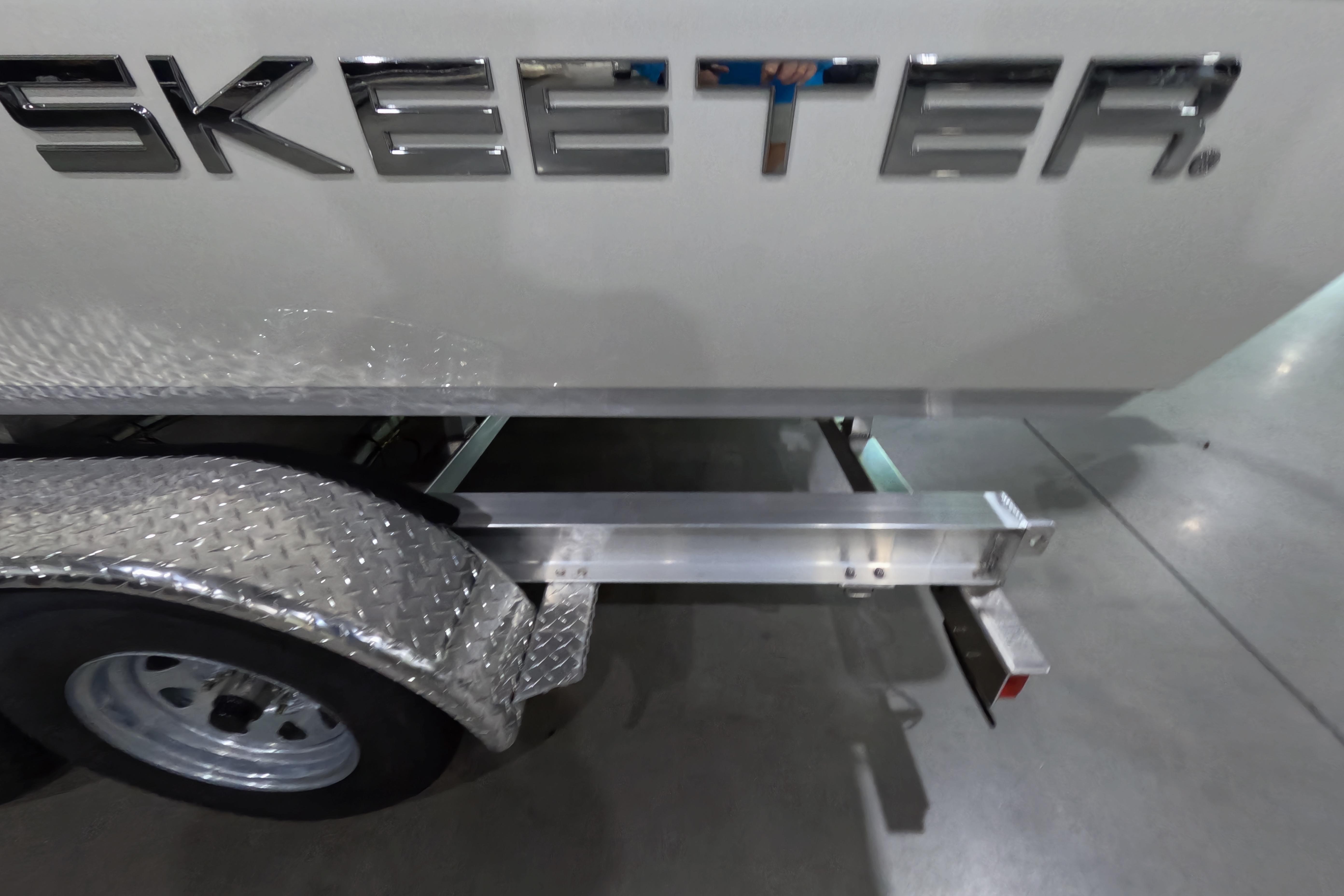 2026 Skeeter SX221 boat trailer with diamond plate fender and logo.