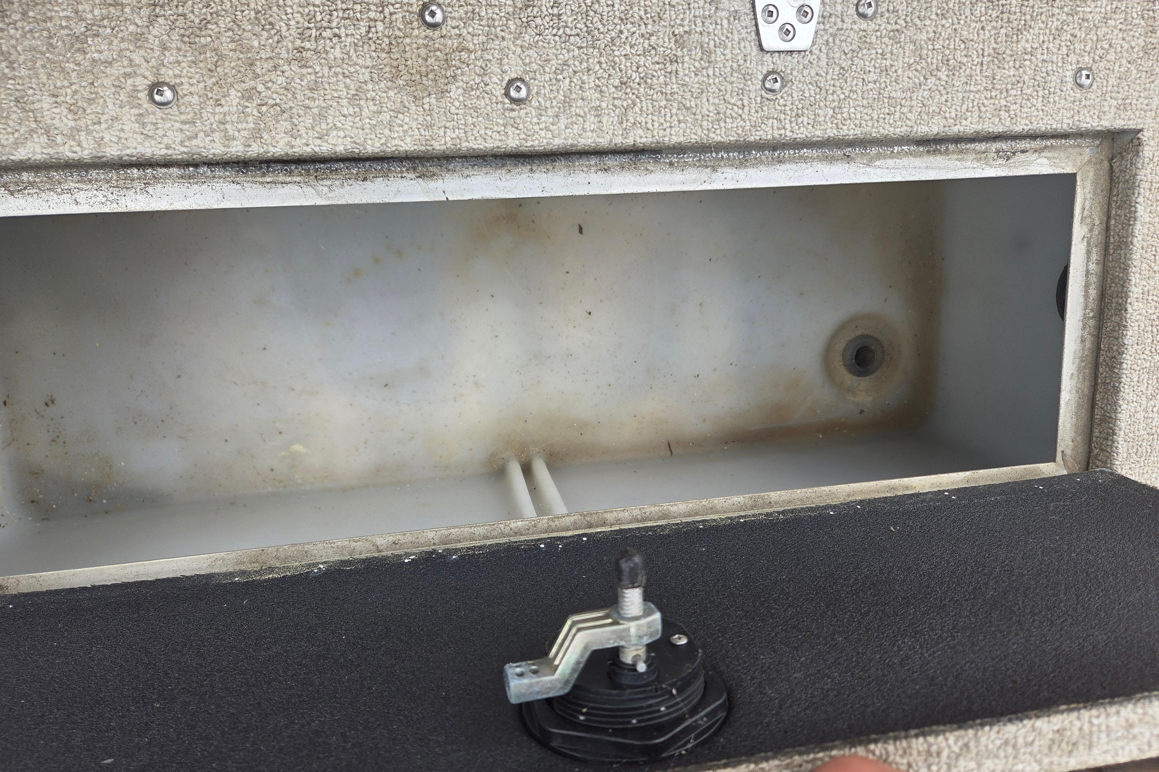 Open storage compartment in 2016 Crestliner 1650 Fish Hawk SC boat.