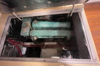 Engine compartment of a 1964 Striker model 120 boat, showcasing vintage machinery.