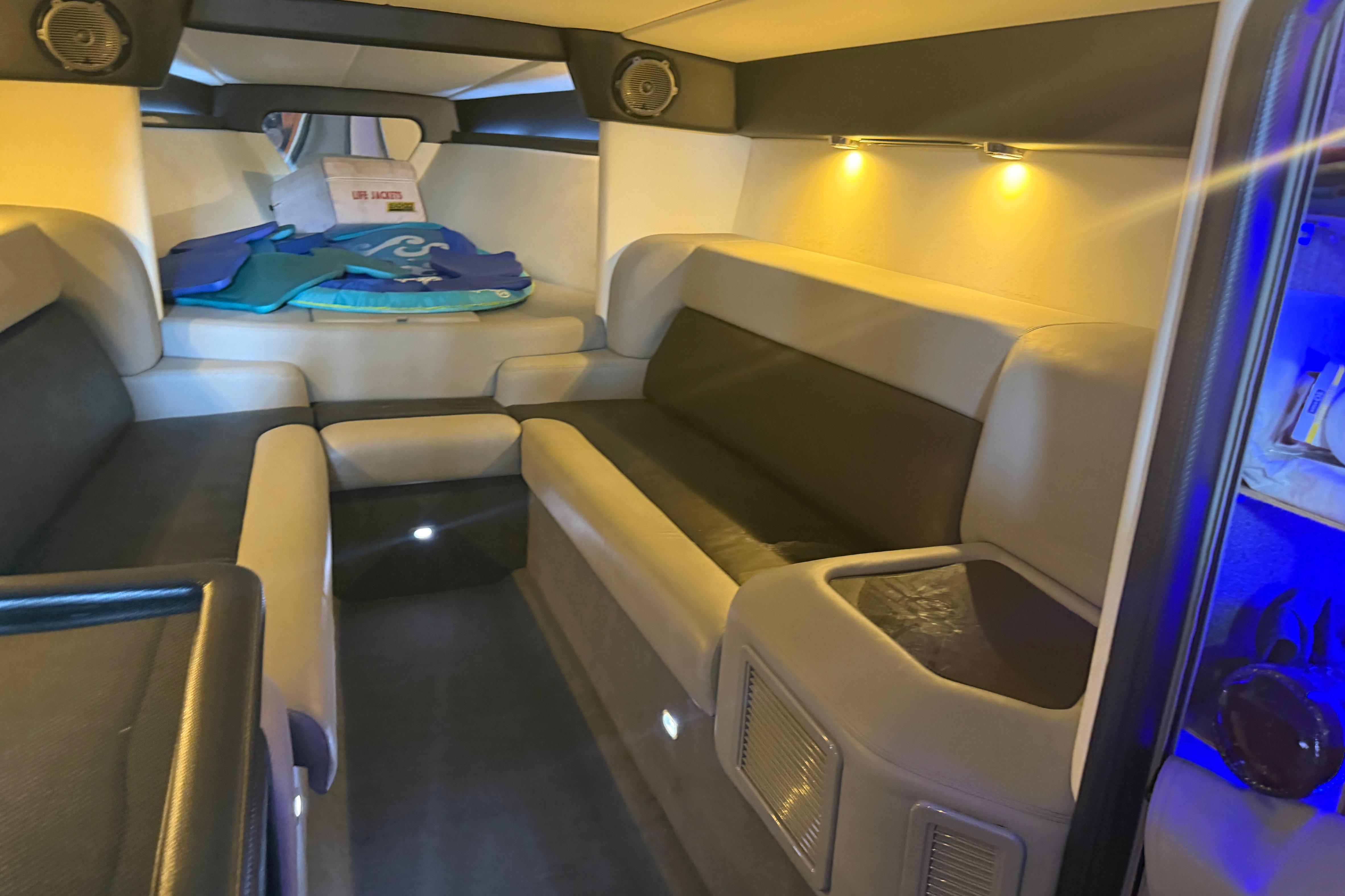 Luxurious interior of 2013 Nor-Tech 477 SPX Vee Bottom boat with seating and ambient lighting.