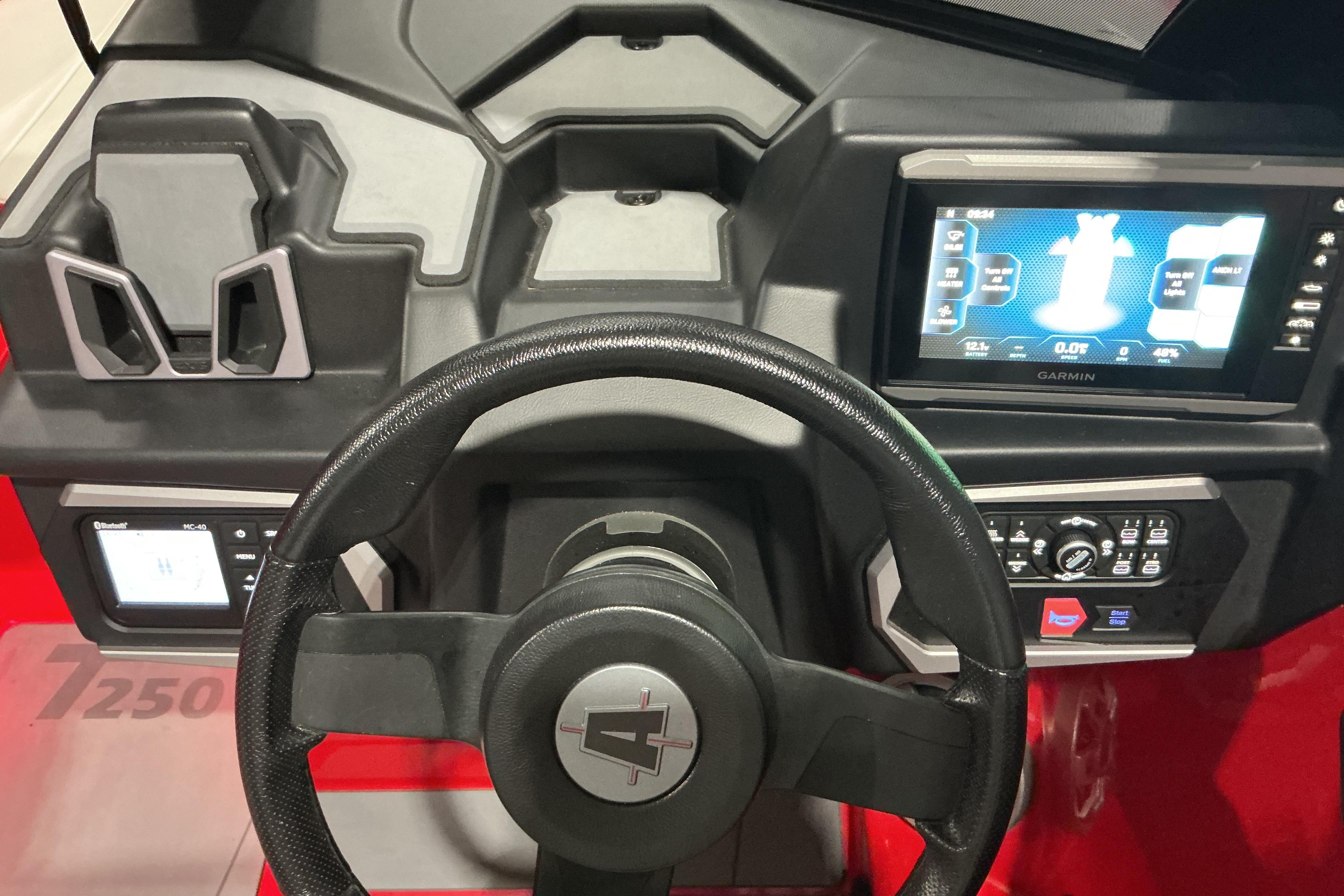 2022 Axis T250 dashboard with steering wheel and Garmin display.