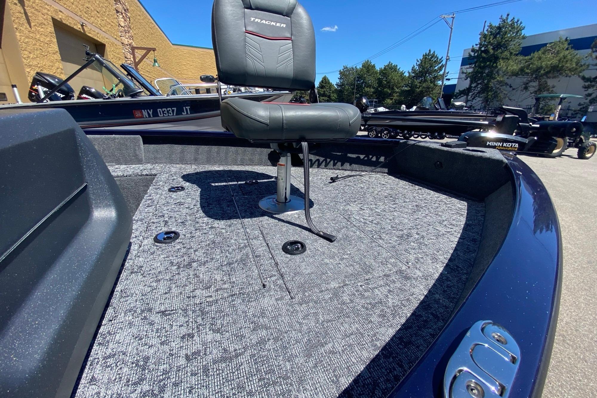 2026 Tracker Pro Guide V-16 SC boat with swivel seat and carpeted deck.