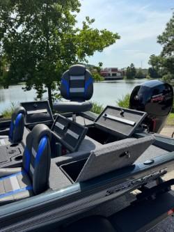 2025 Ranger RT198P boat by the lake with blue seats.