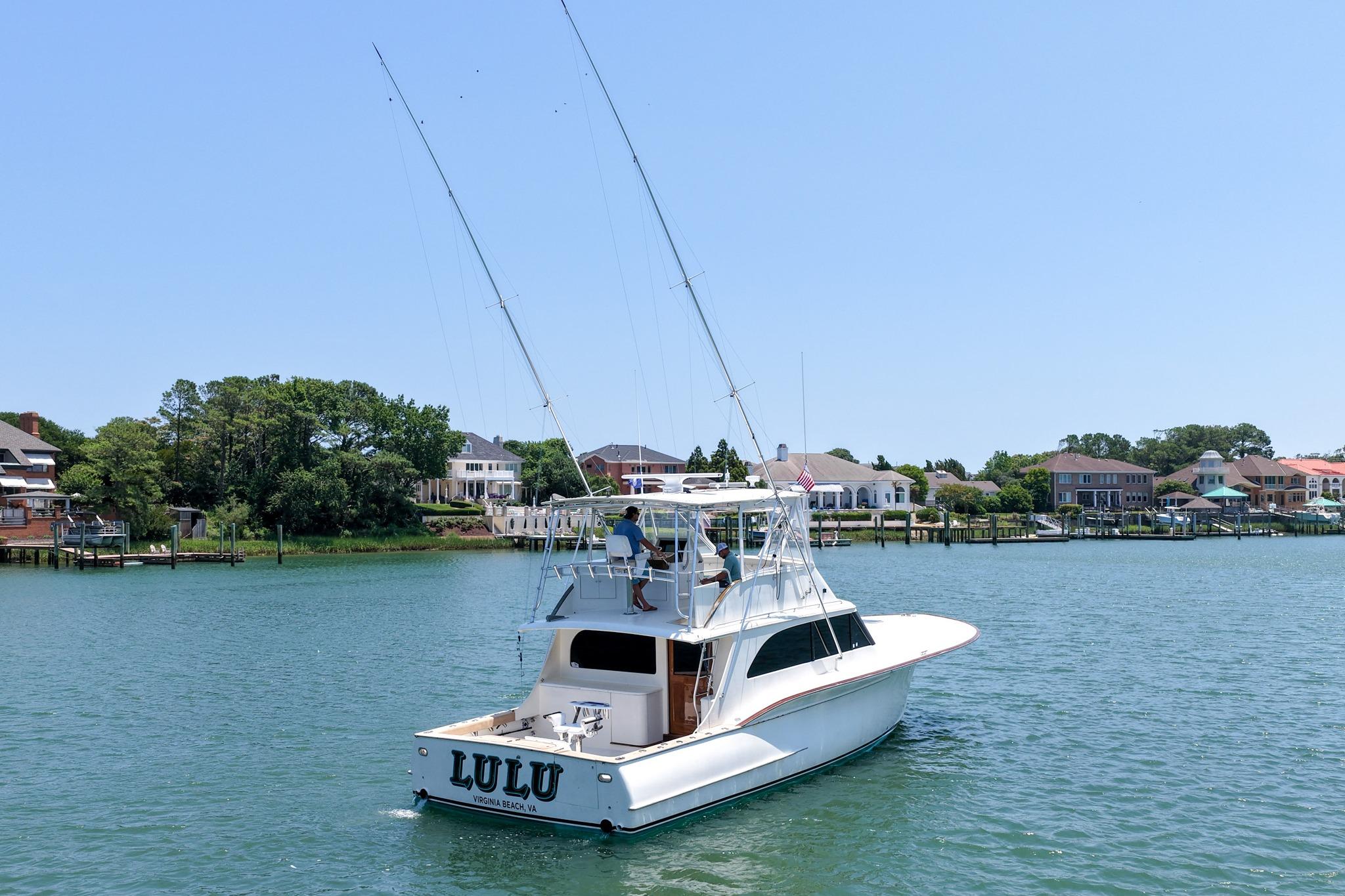 1998 Blackwell Custom Carolina Sportfish boat on water near residential area.