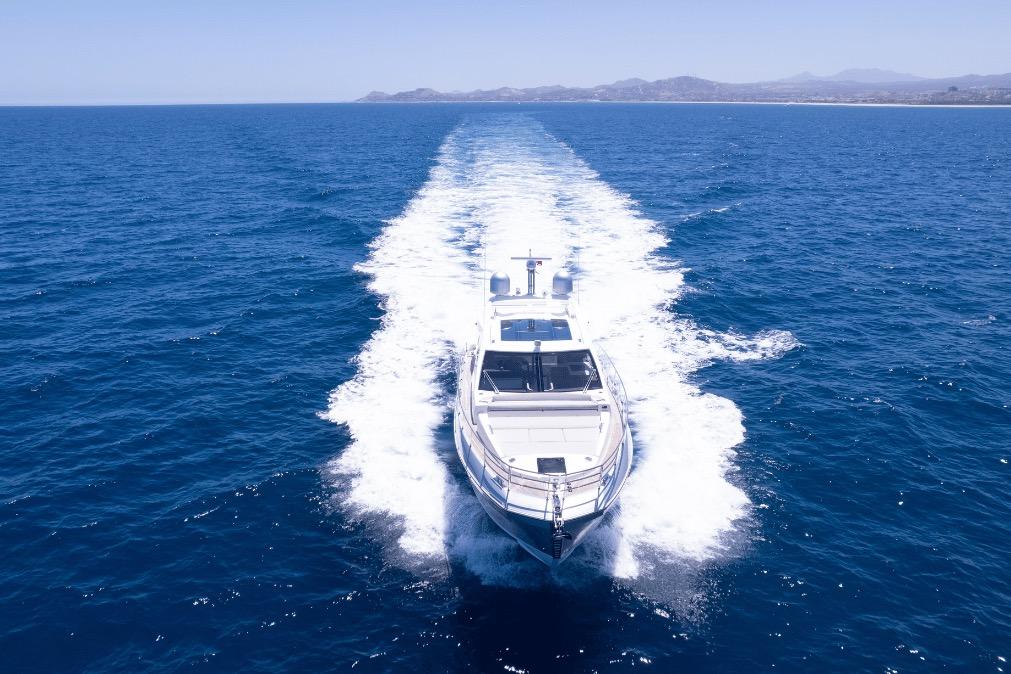 Azimut 60 yacht cruising on open sea, 2020 model, leaving a wake behind.