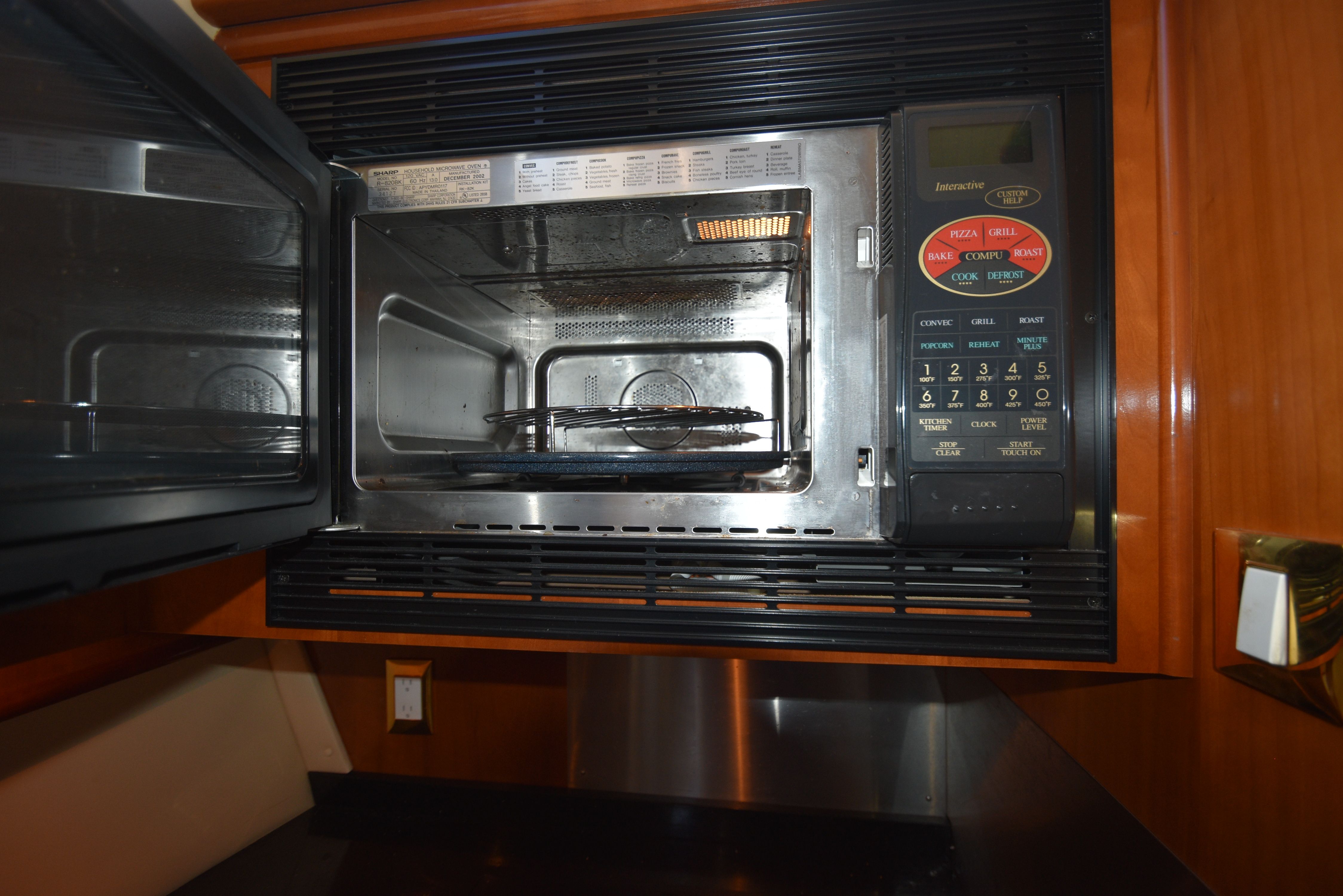 Microwave in the kitchen of a 2004 Carver 466 Motor Yacht.