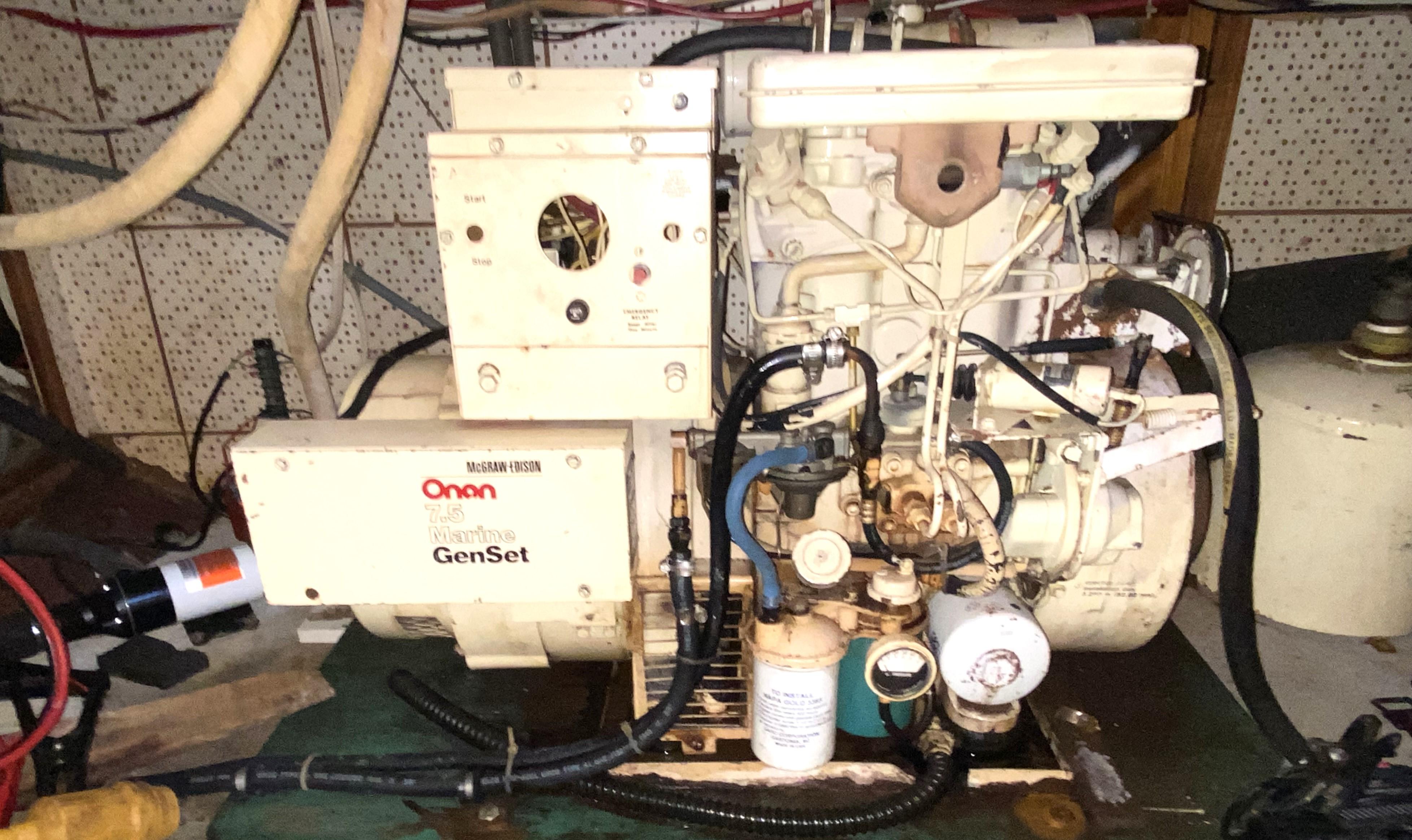 1983 DeFever 41 Onan Marine GenSet engine in a boat's engine room.