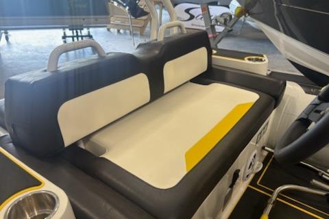 2026 Highfield Velox 420 boat interior with black and white seating and yellow accents.