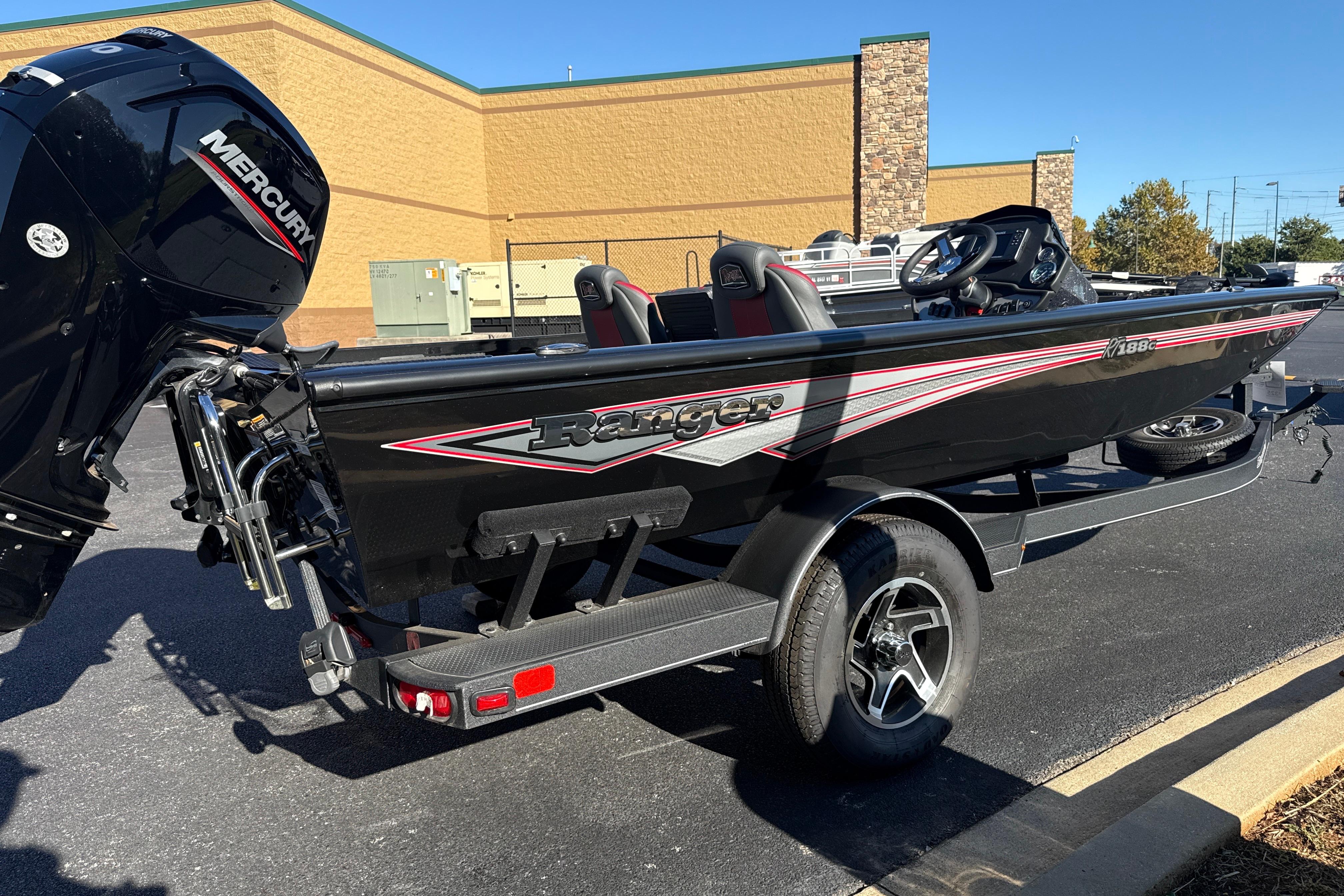 2025 Ranger RT188C boat with Mercury engine on a trailer in a parking lot.