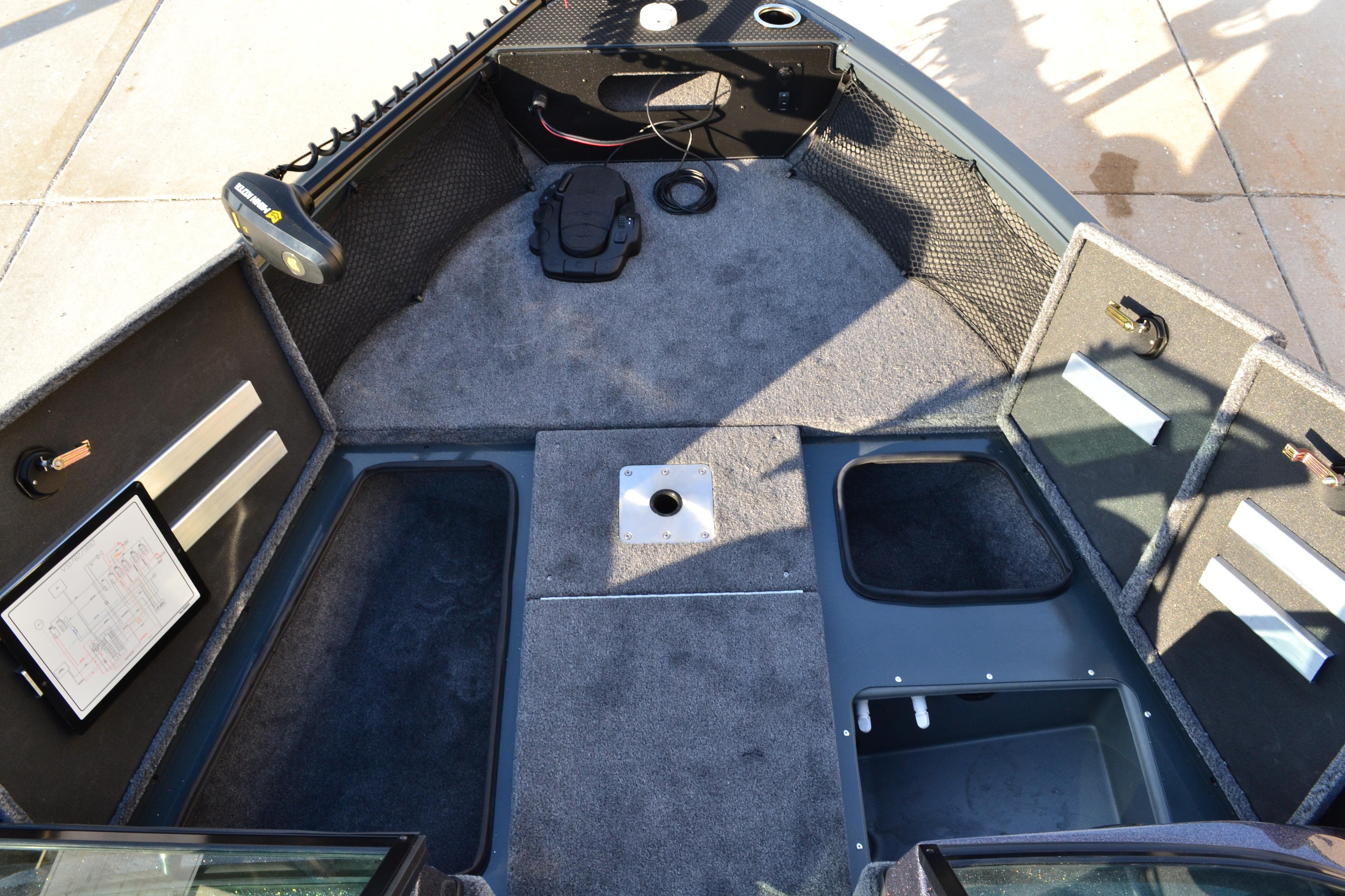 2026 Ranger VS1882SC Reata boat interior with storage compartments and carpeted flooring.
