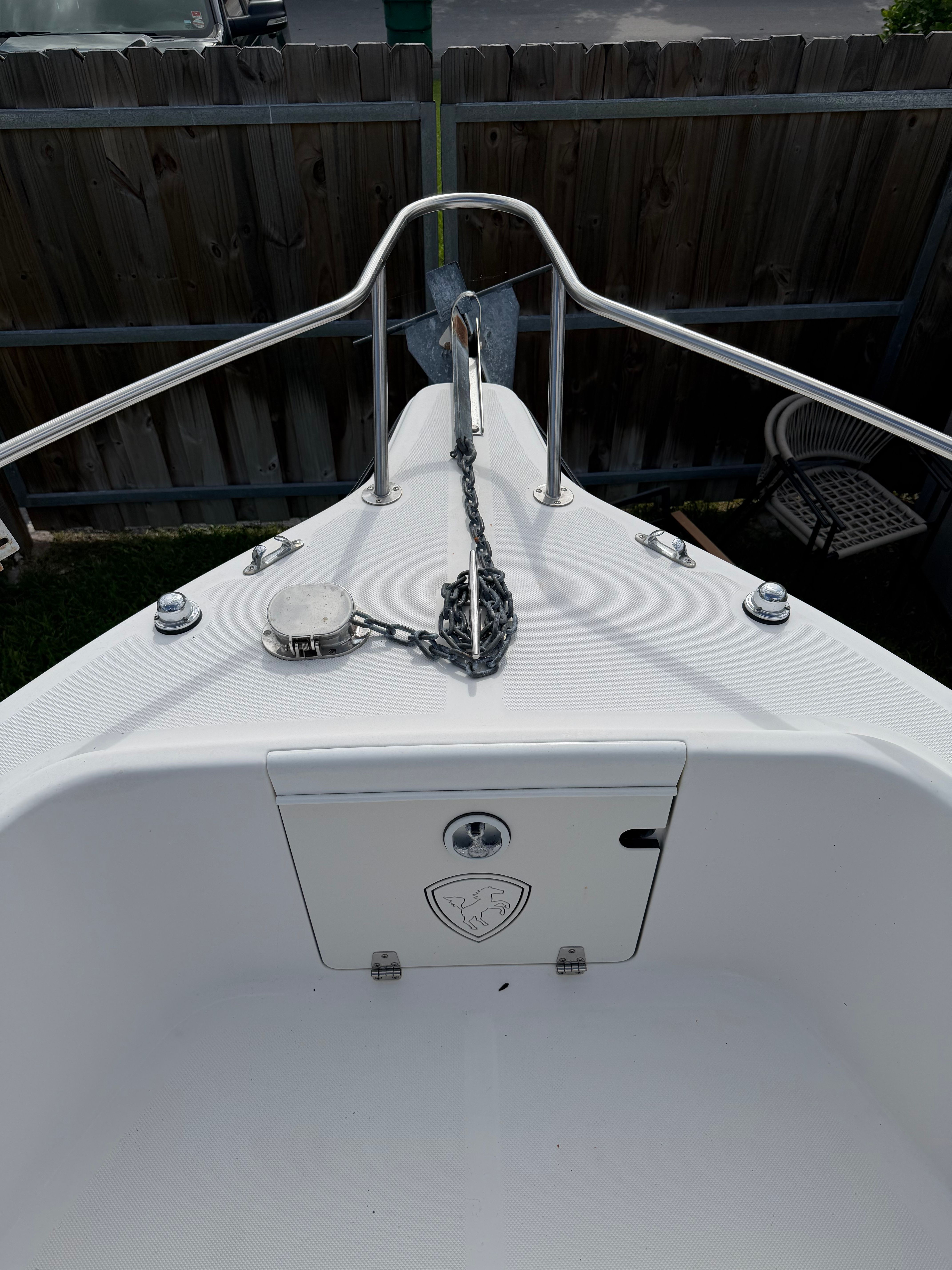 The image shows the bow of a 2001 Century 2100 Center Console boat with anchor chain.