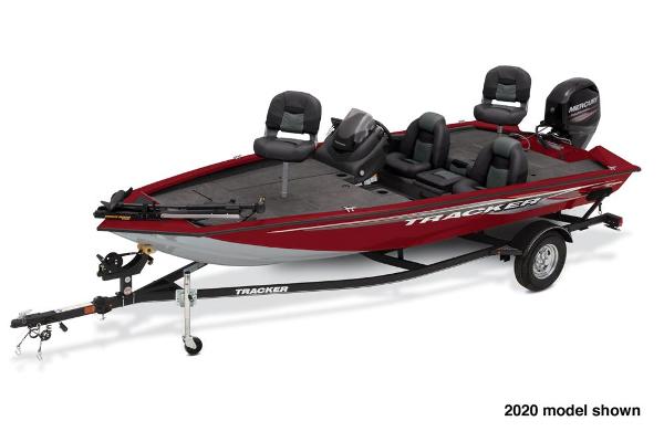 A red Tracker boat on a trailer, featuring four seats and an outboard motor.
