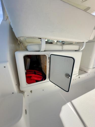 Storage compartment on 2006 Tiara Yachts 3200 Open, featuring a red life jacket.