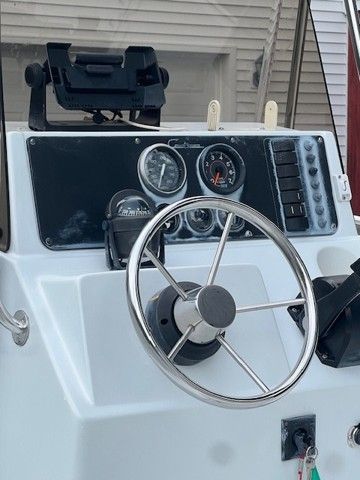 Steering console of a 2000 Pro Sports 1850 boat.