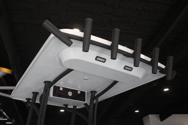 2025 East Cape 25 Open boat with rod holders and LED lights on the T-top.